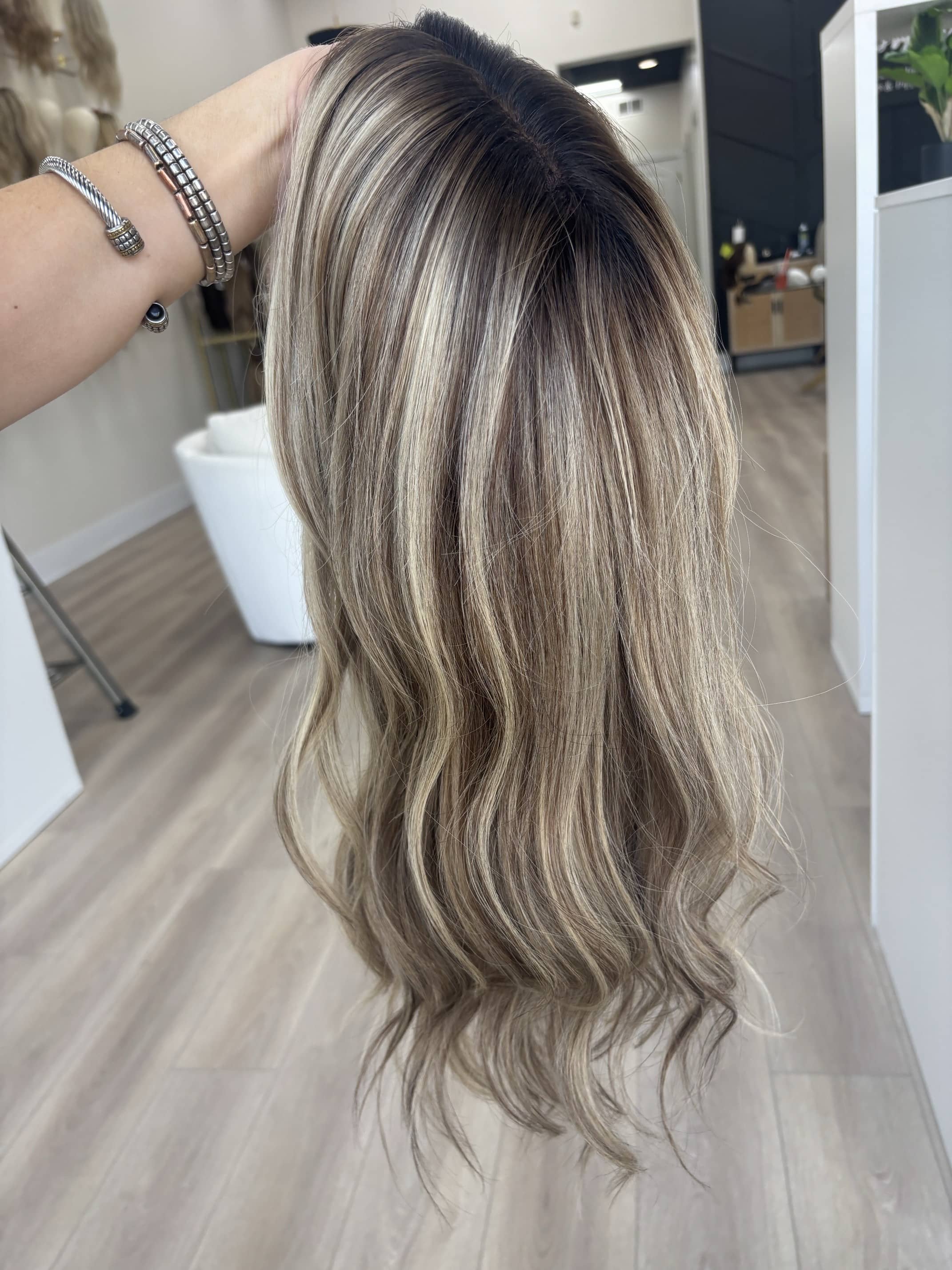 Brunette_human_hair_wig_with_caramel_highlights_worn_by_a_woman_in_Folsom_Studio__.jpg