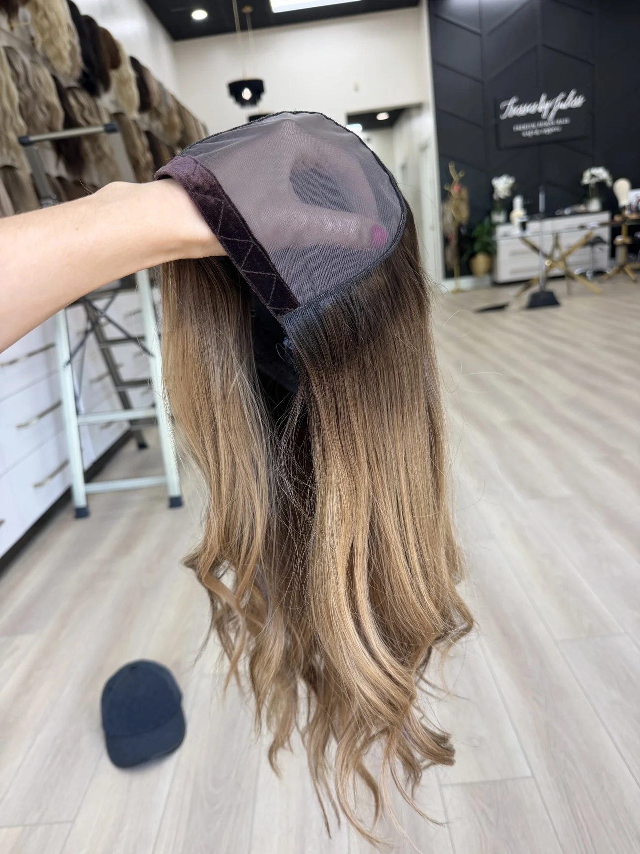_Elegant_brunette_wig_with_natural_highlights__styled_on_a_woman_in_Sacramento_Studio___.jpg