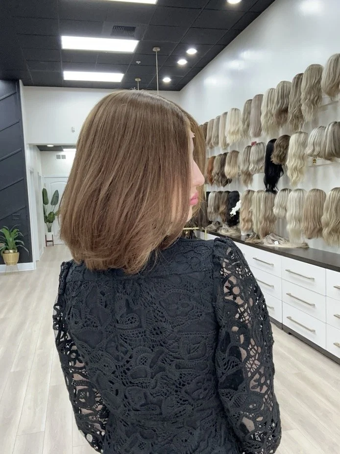 Brunette_human_hair_wig_with_caramel_highlights_worn_by_a_woman_in_Folsom_Studio__.jpg