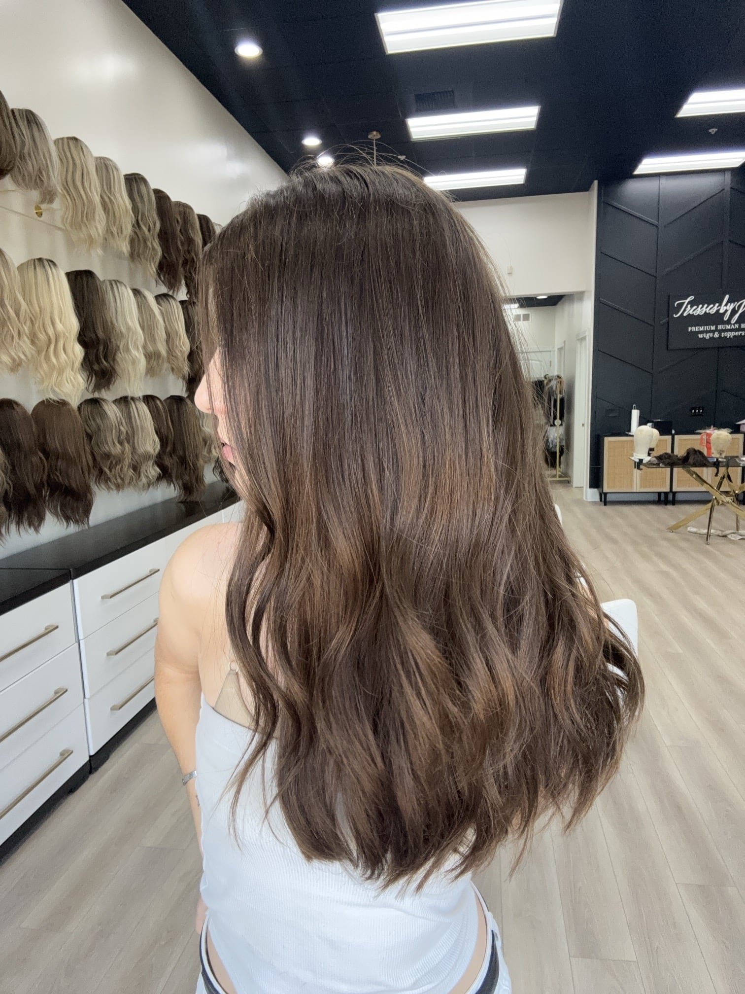 _Long_wavy_chestnut_brown_wig_styled_on_a_woman_at_Tresses_By_Juless_Studio__Sacramento___.jpg