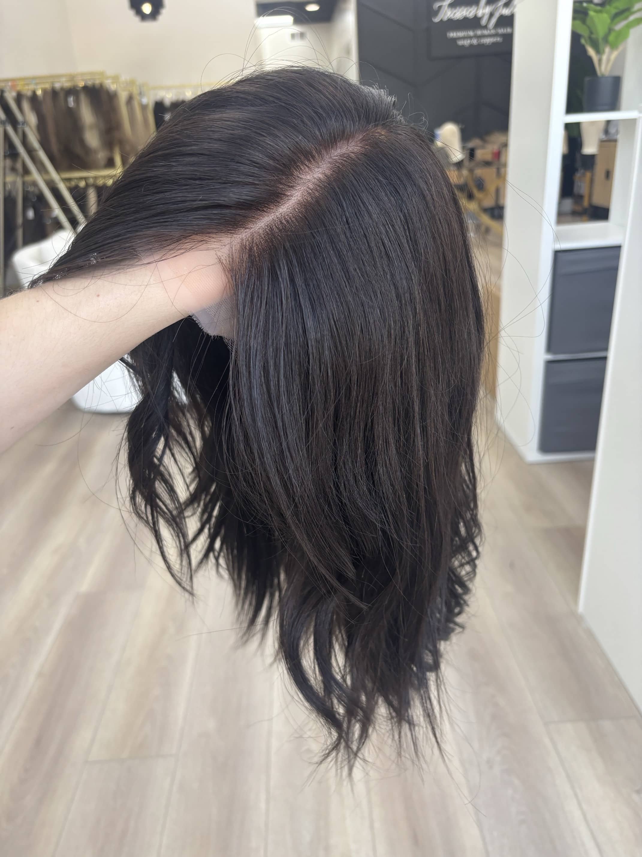 _Elegant_brunette_wig_with_natural_highlights__styled_on_a_woman_in_Sacramento_Studio___.jpg
