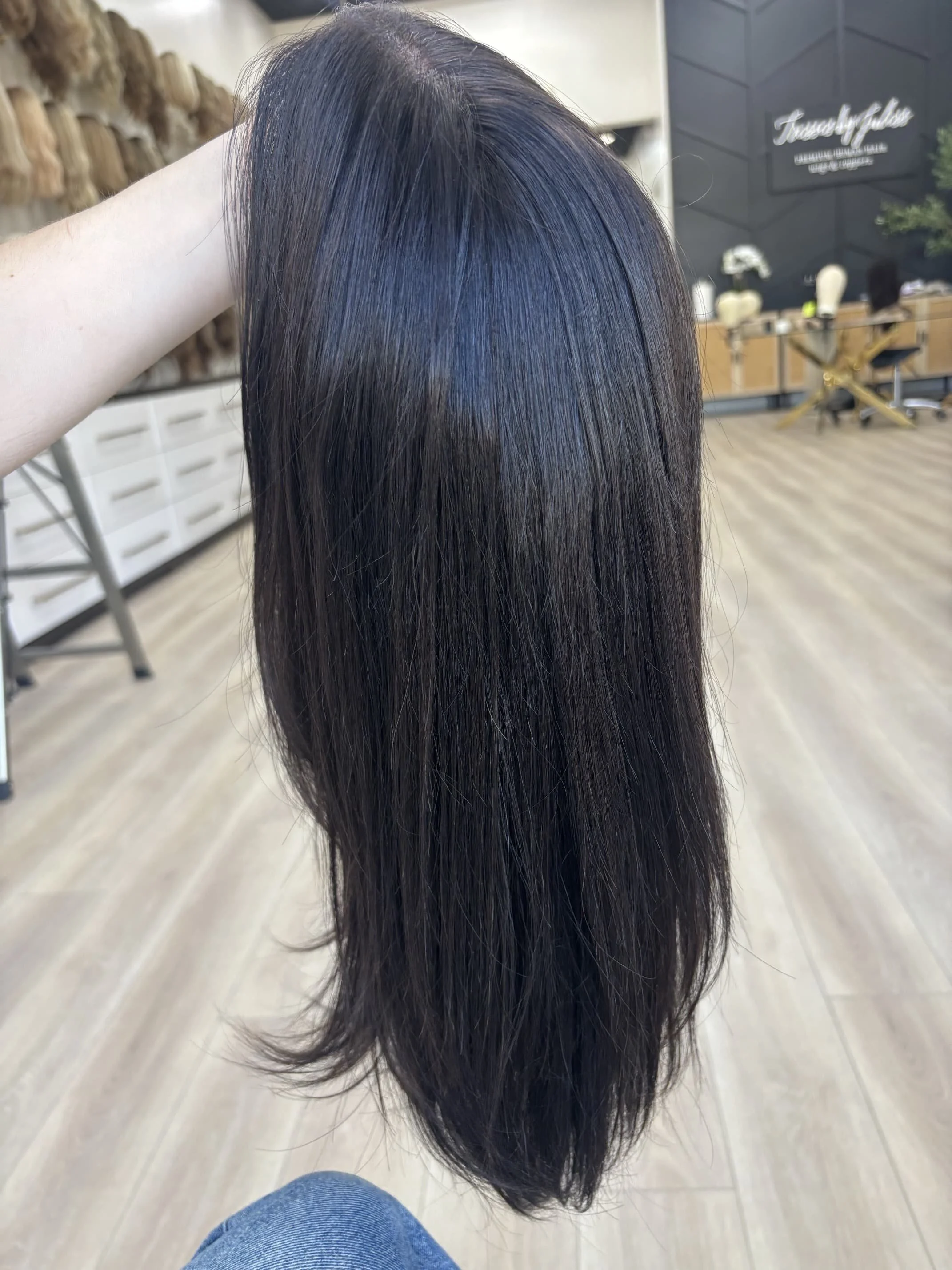 _Deep_red_wavy_wig_worn_by_a_woman_inside_Tresses_By_Juless_Studio__Citrus_Heights__Folsom___.jpg