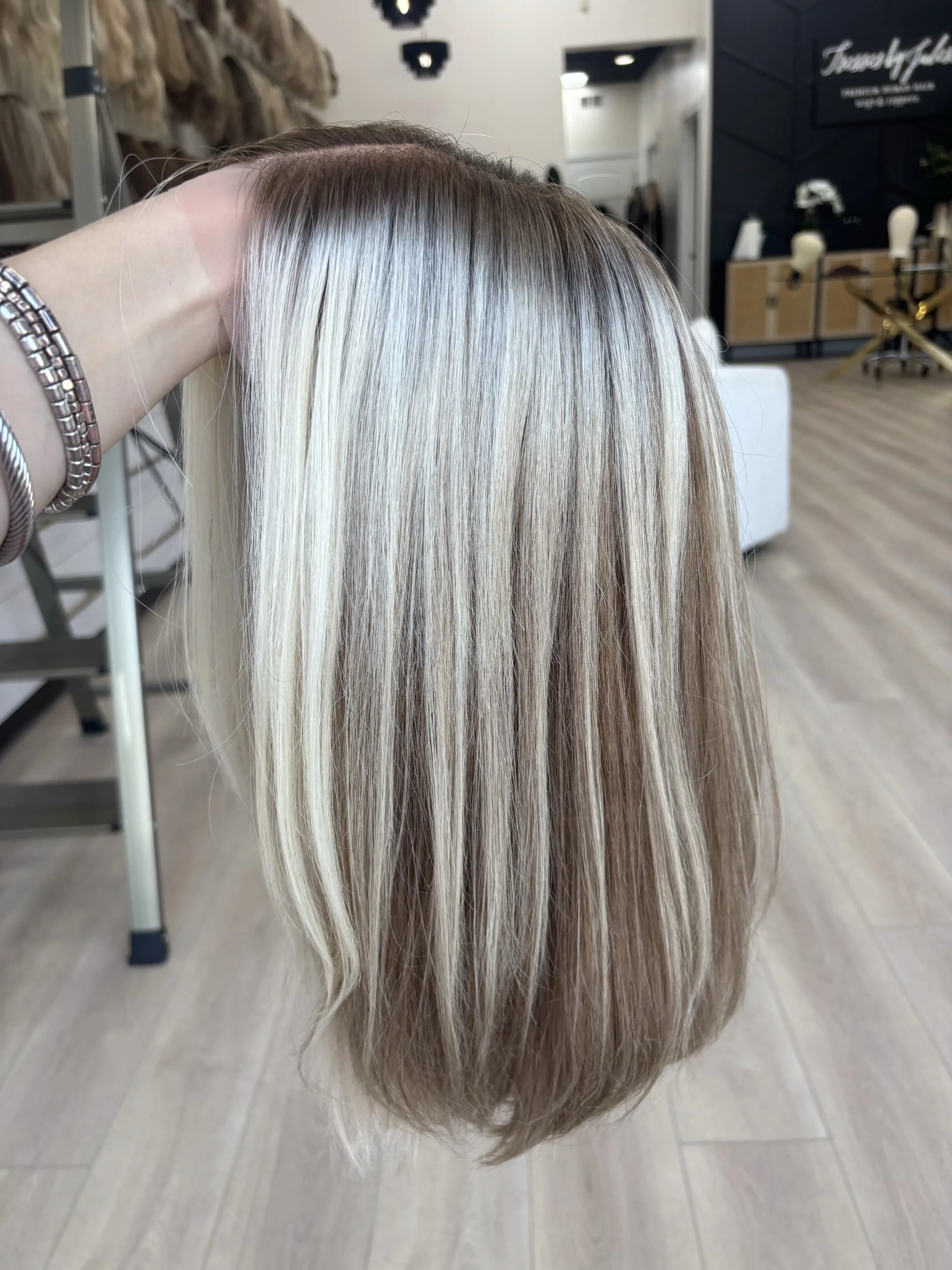 _Elegant_blonde_bob_wig_worn_by_a_woman_at_Tresses_By_Juless_Studio__Sacramento___.jpg