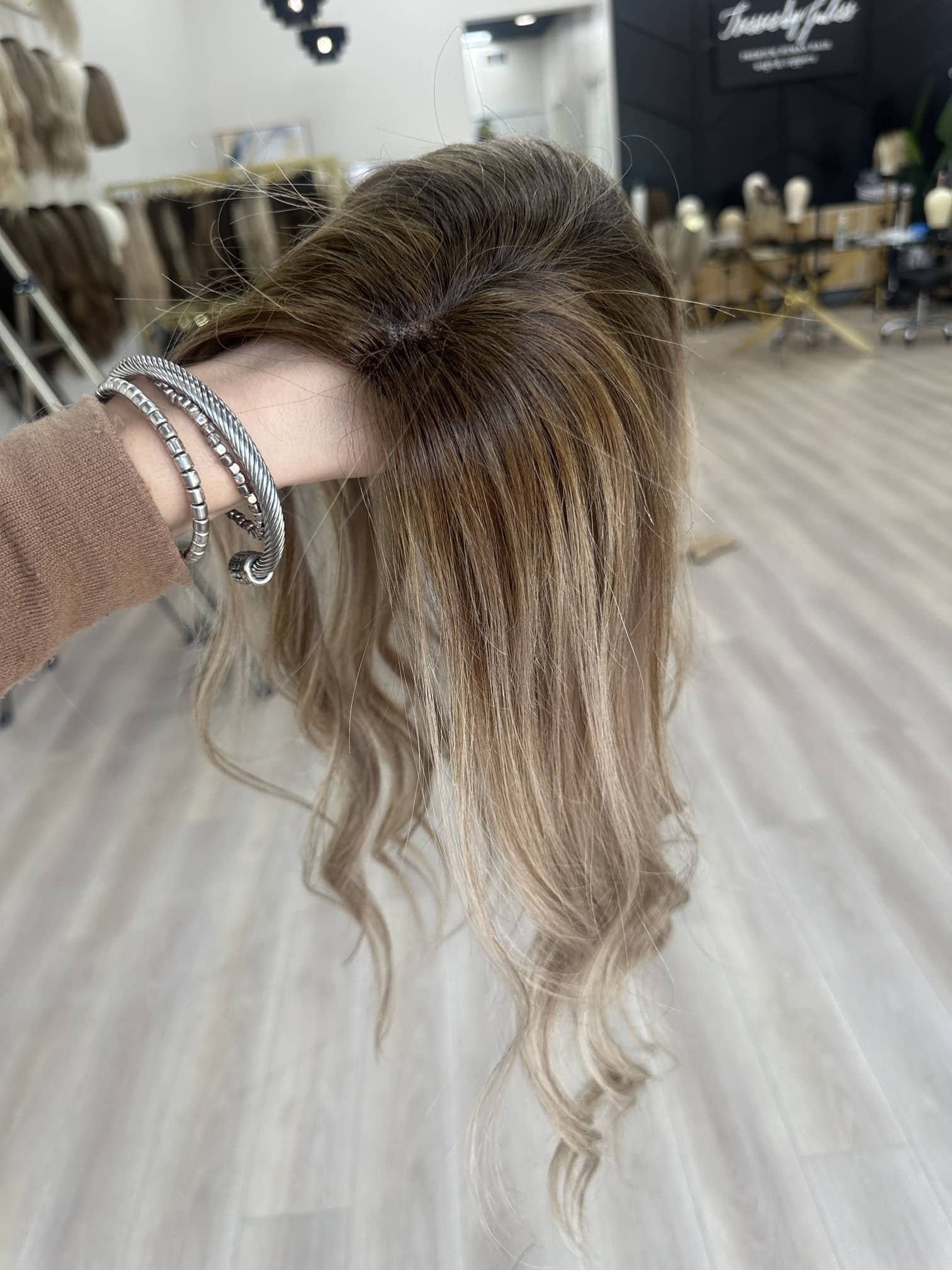 _Elegant_brunette_wig_with_natural_highlights__styled_on_a_woman_in_Sacramento_Studio___.jpg