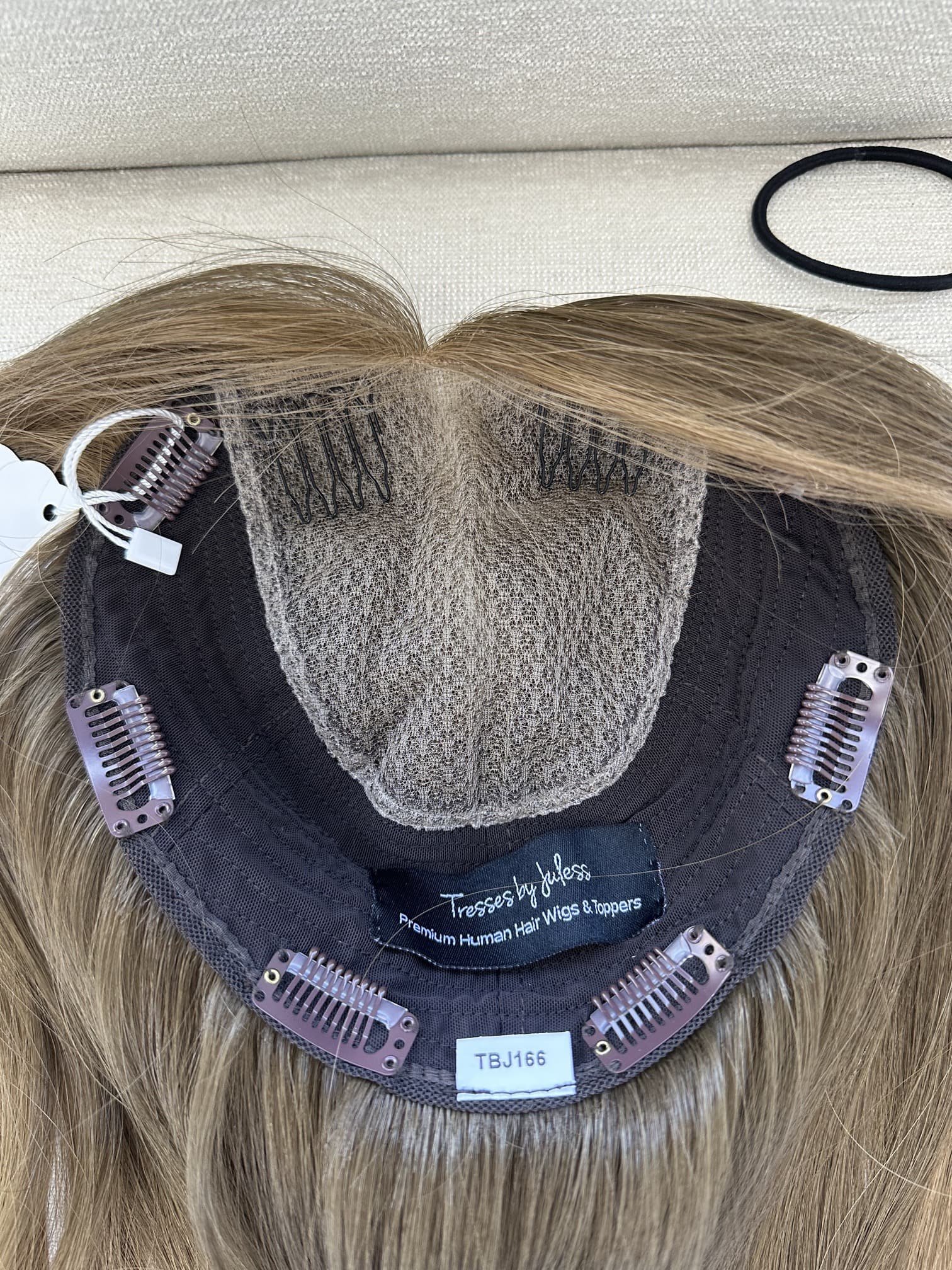 Brunette_human_hair_wig_with_caramel_highlights_worn_by_a_woman_in_Folsom_Studio__.jpg