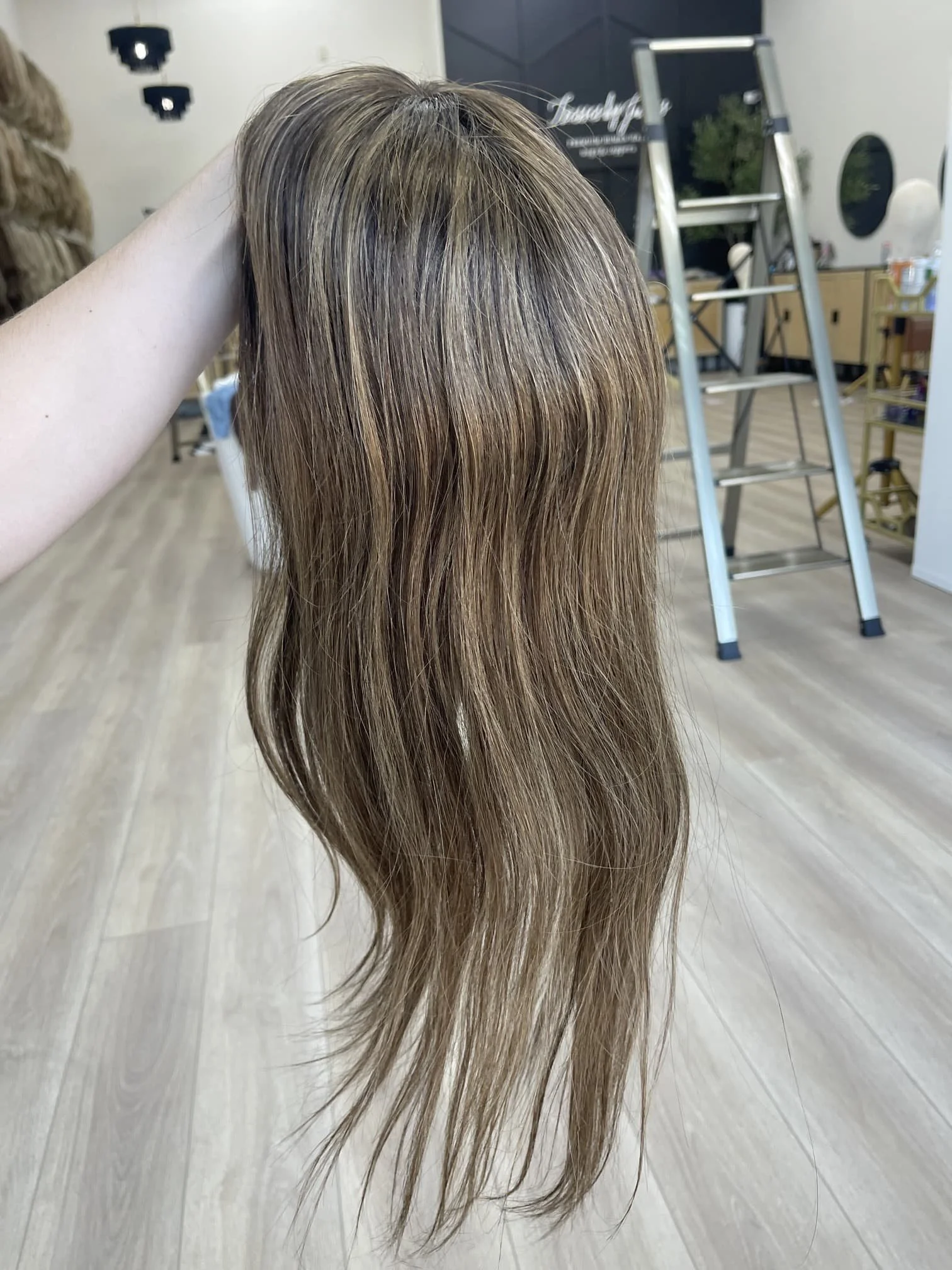 _Woman_with_long_brunette_wavy_human_hair_wig_in_Tresses_By_Juless_Studio__Folsom___.jpg