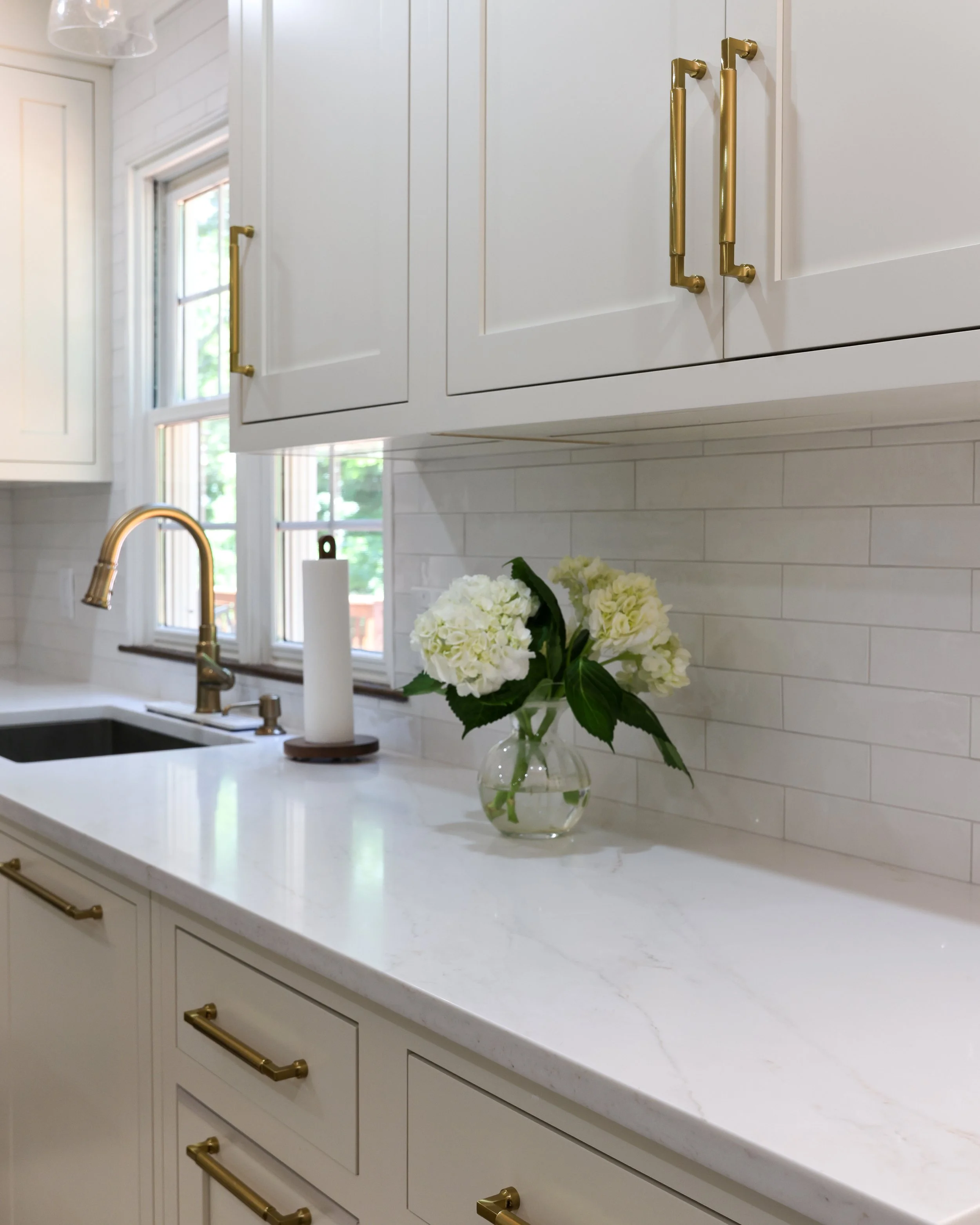 white cabinets with a white couuntertop