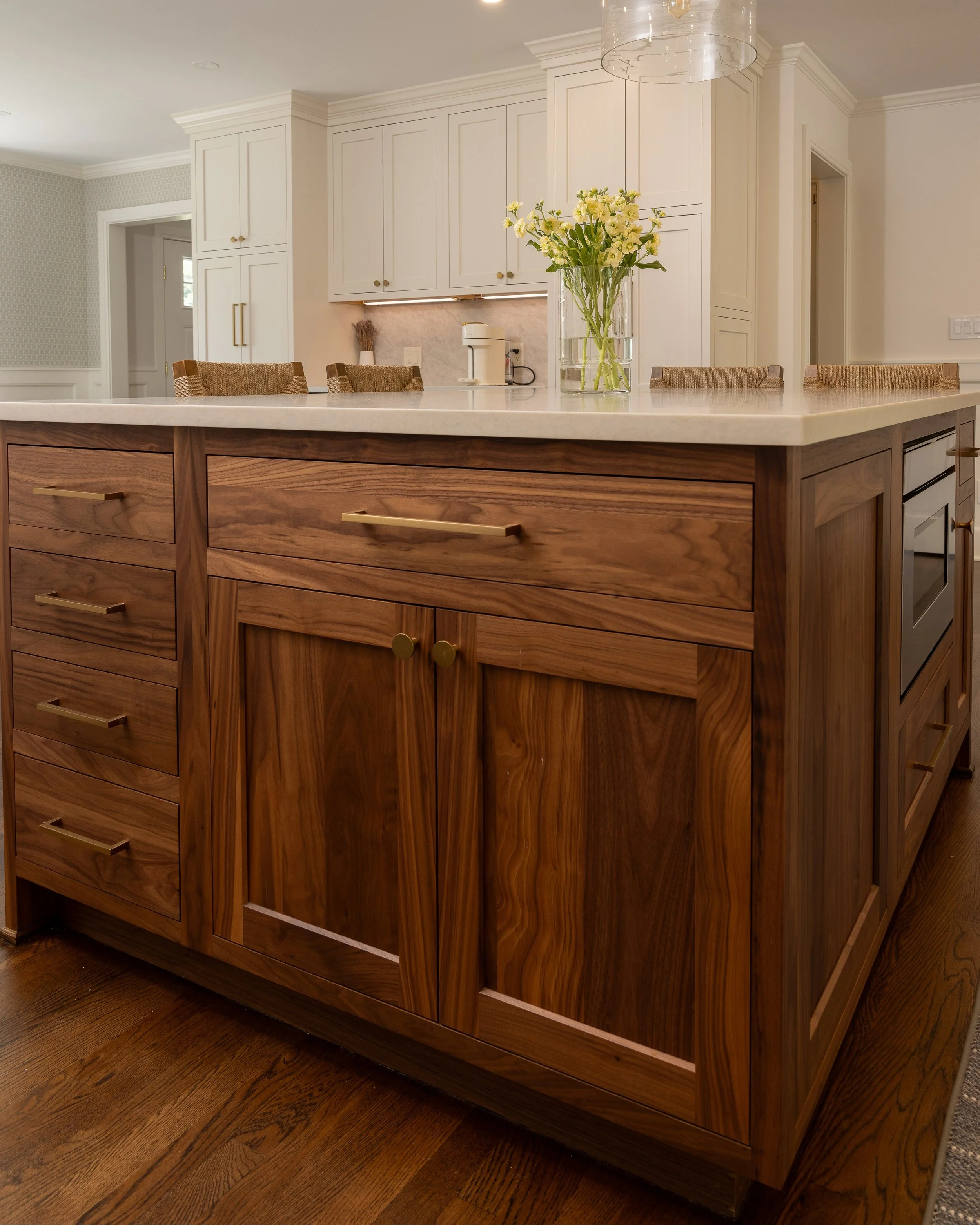 the base of an island with a natural walnut stain