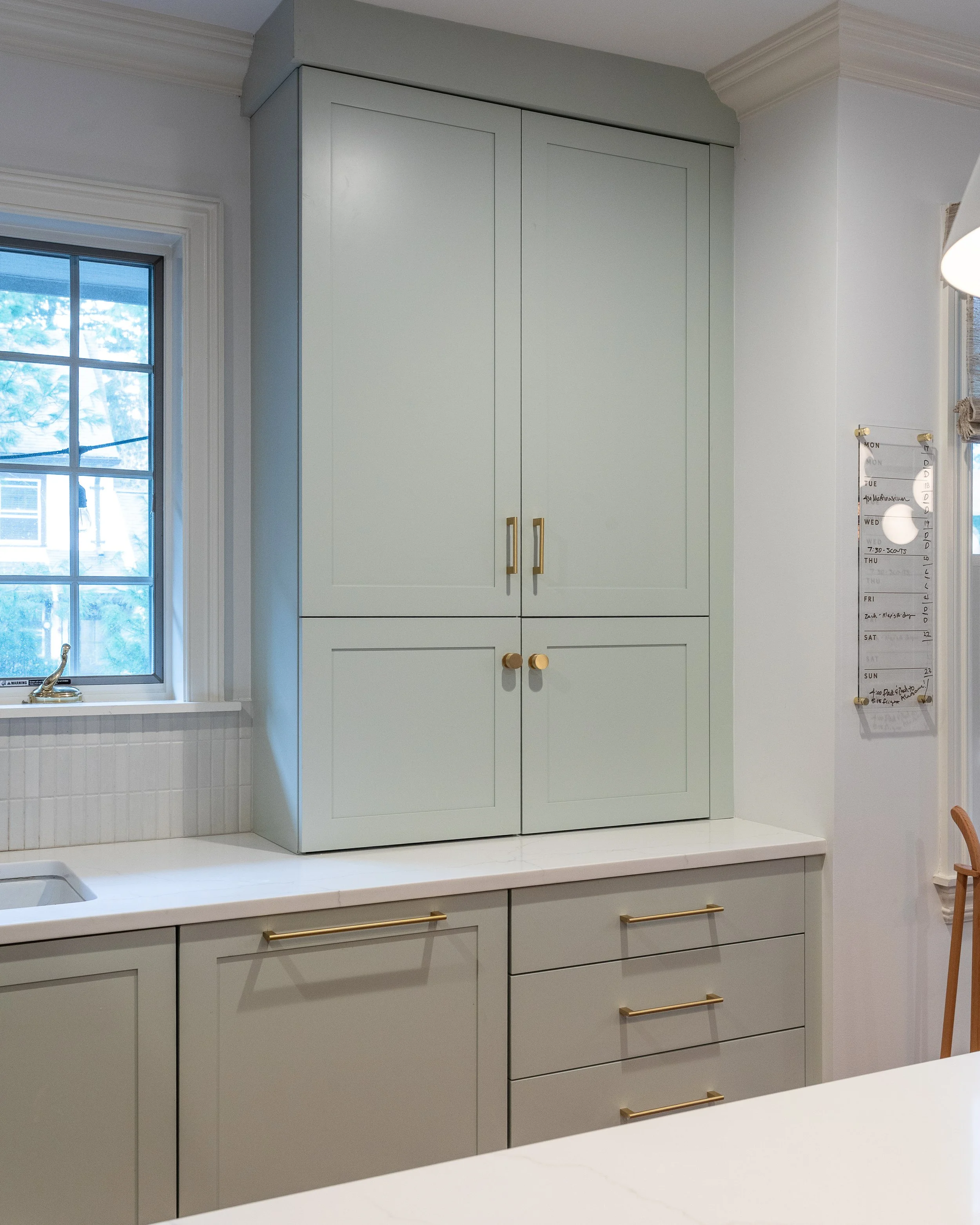 close up of a counter cabinet in a light blue/green