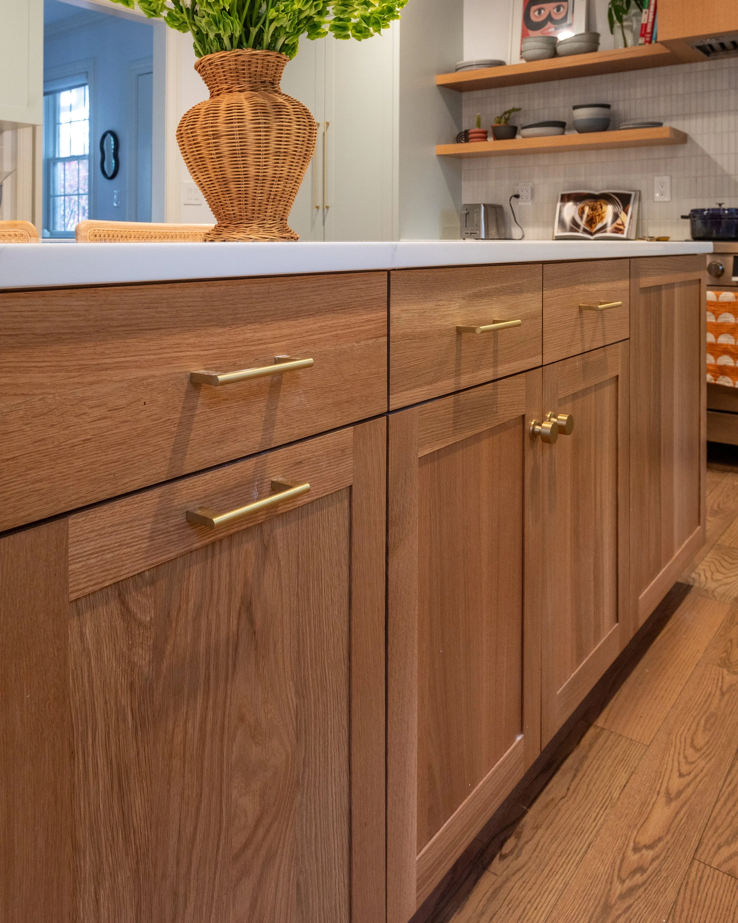 lower light wooden cabinets under the island