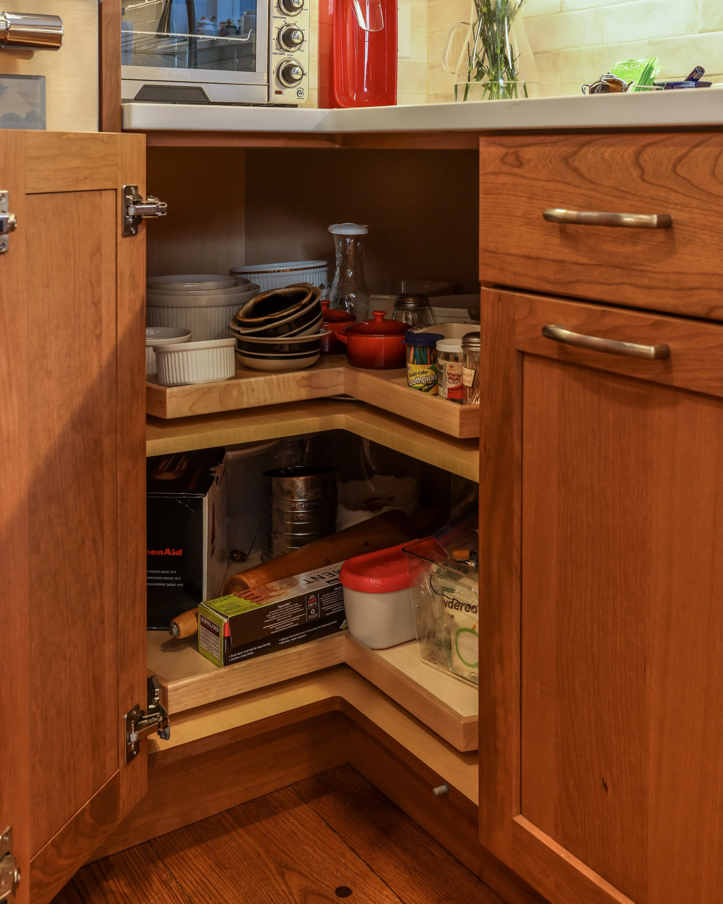 a corner cabinet with rotating shelves
