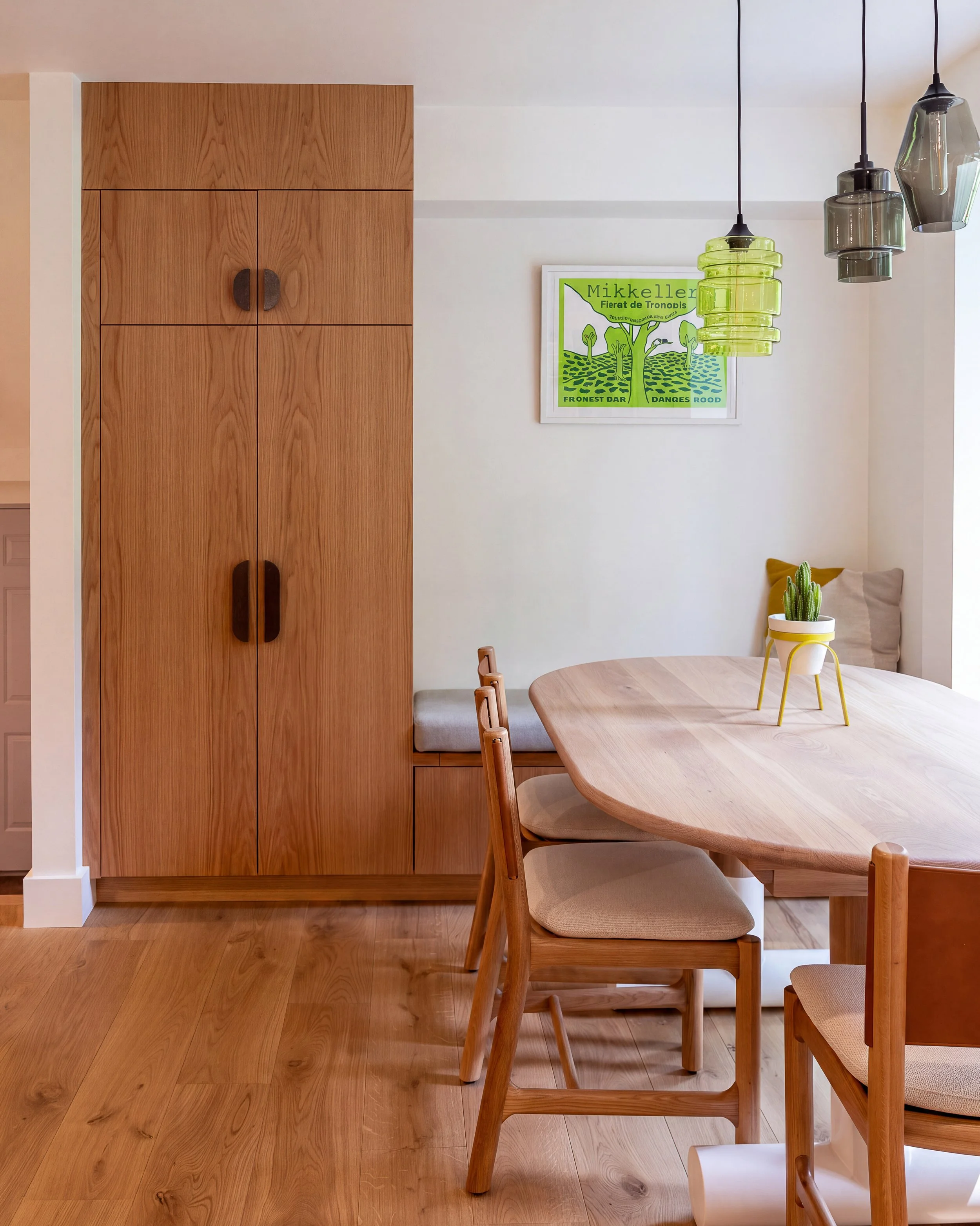a corner of a kitchen with a dining nook