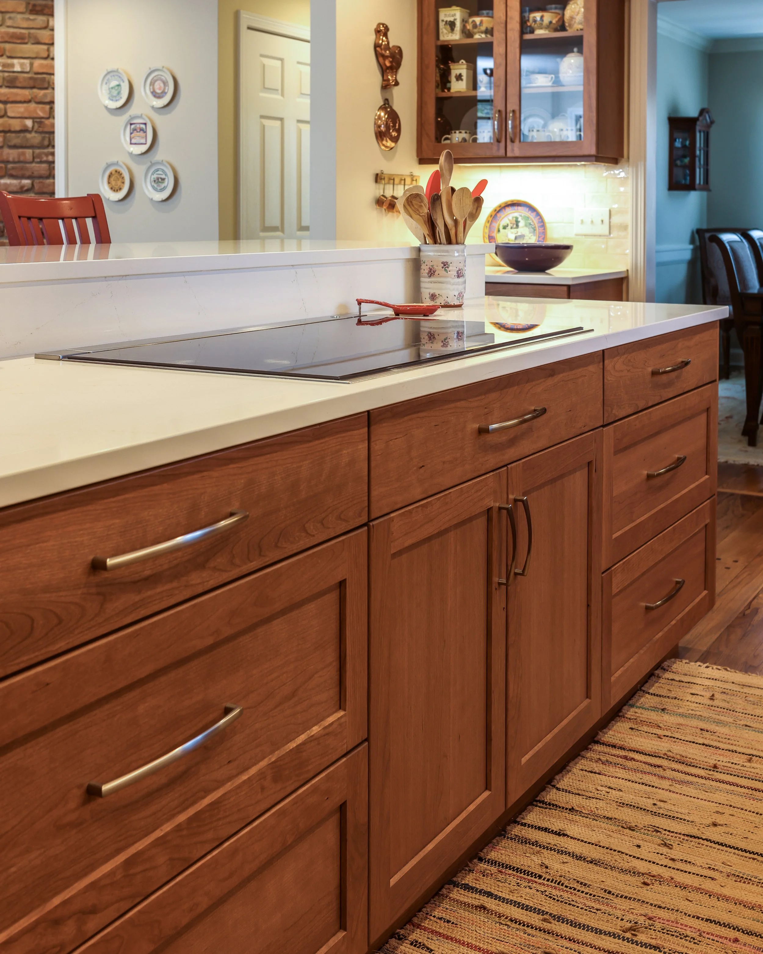 a close up of an island with a buil in range and downdraft ventilation