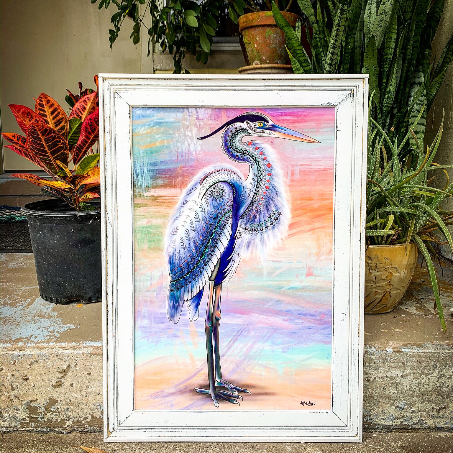 this framed metal egret print (blue heron art) is from ornamental wildlife artist Amanda Vela-Charbonneau's coastal collection.