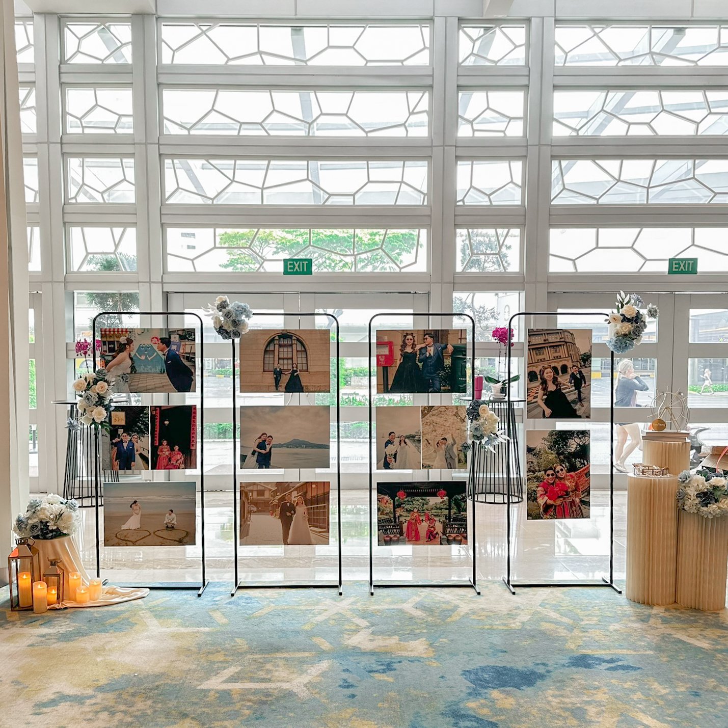 Blue and white florals and black gallery display stands for a wedding at Pan Pacific Singapore