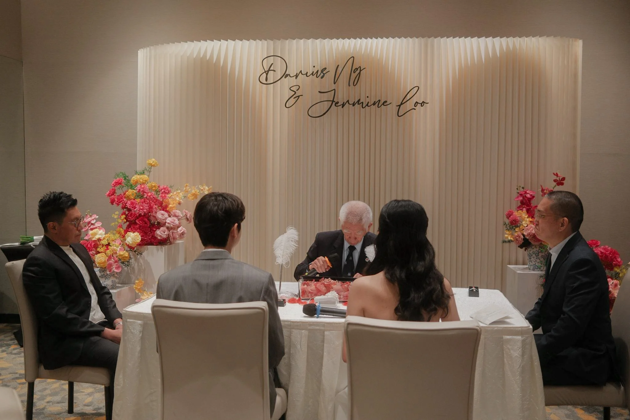 Oriental style flowers and backdrop for a wedding solemnisation ROM