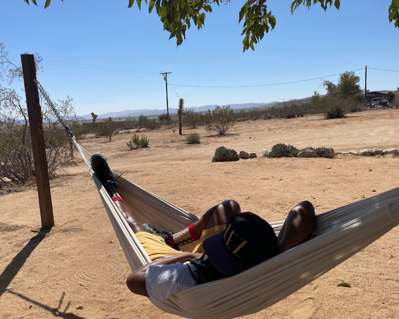 A person relaxing in a hammock at Joshua Tree, CA, USA