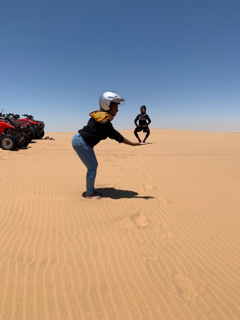 Couple having fun in the desert of Swakopmund, Namibia