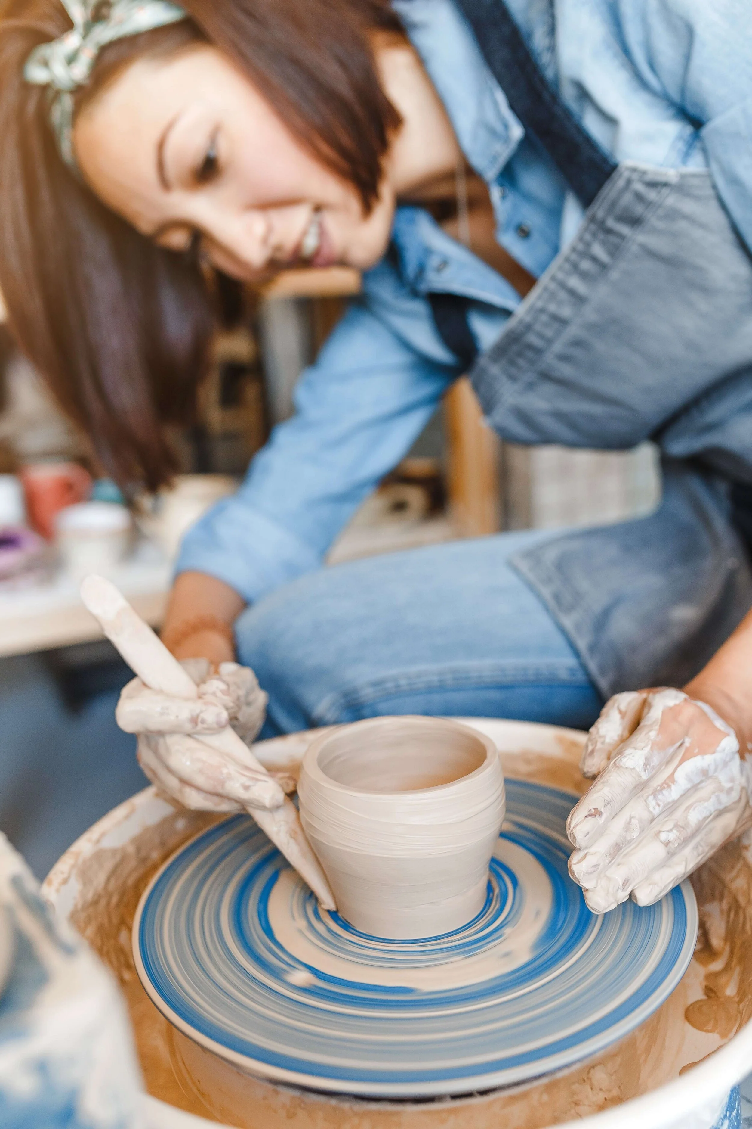 Person working on pottery
