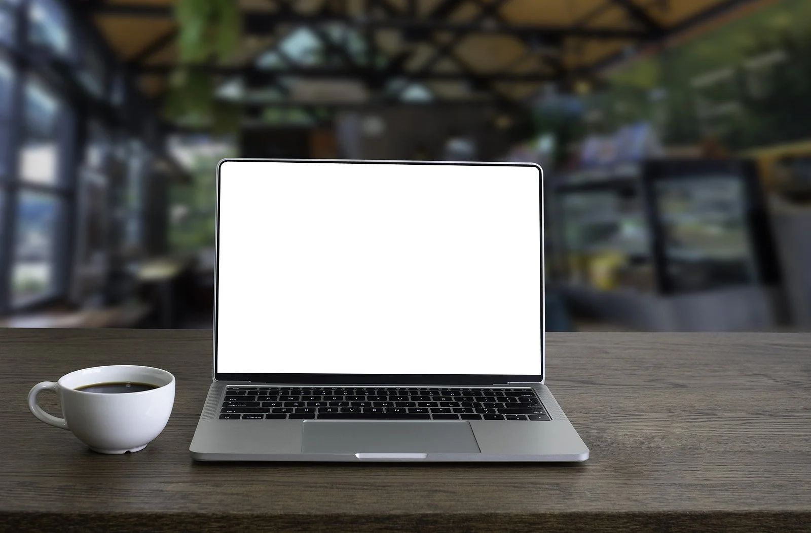 Image of a computer and coffee.