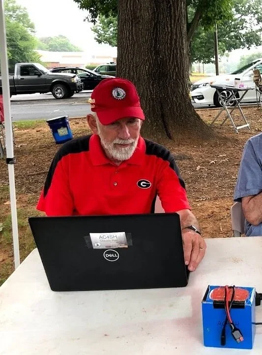 Claude AC4SH logging contacts at Field Day.