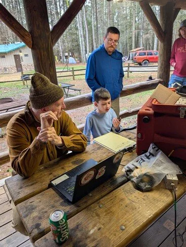David, son of Steve AK4ZG, making first HF QSOs under supervision of James KF4AQO, at the 2026 POTA  Extravaganza.