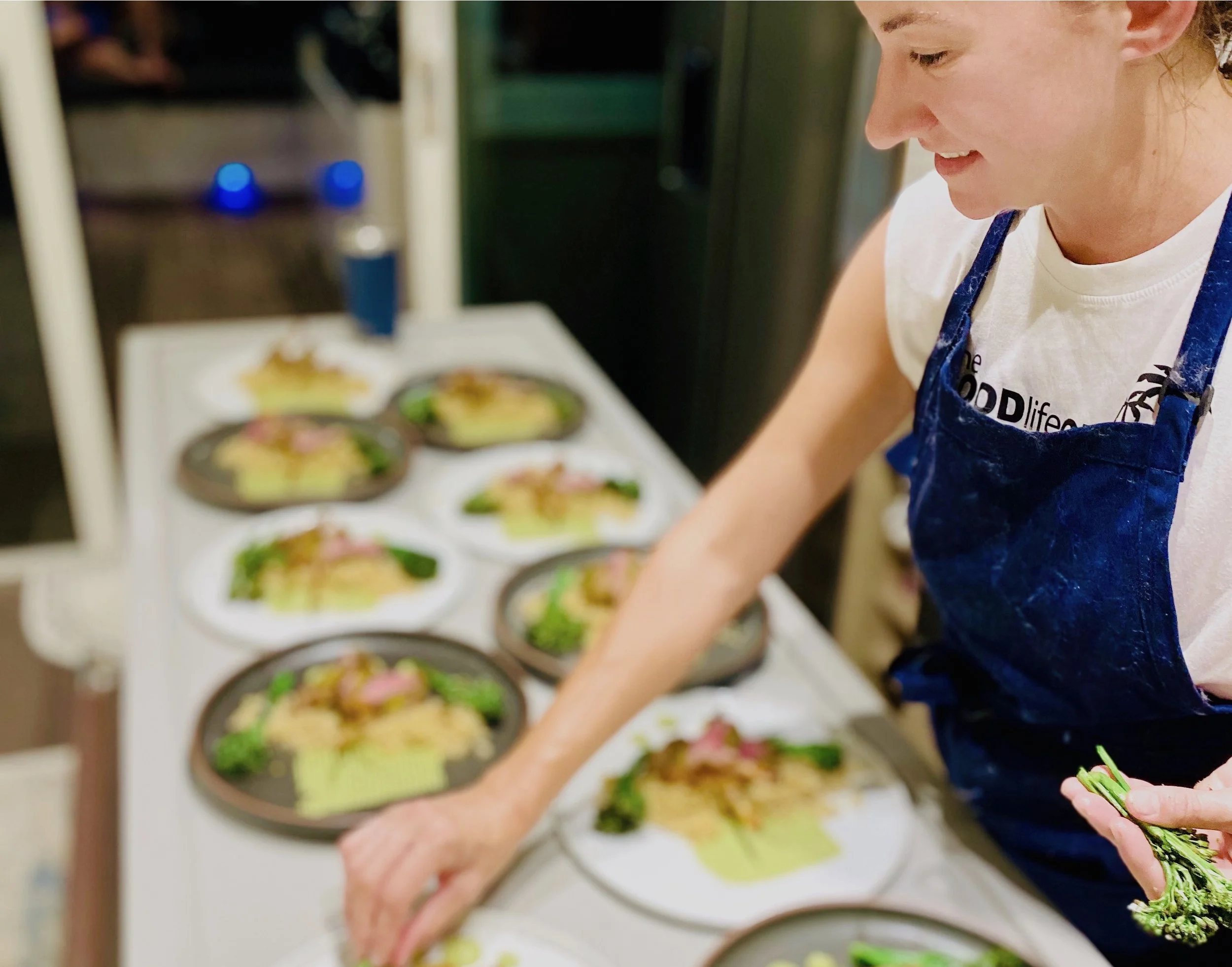 Chef Charli plating lamb.jpg