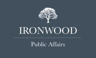 Logo for Ironwood Public Affairs featuring a white tree above the text 'IRONWOOD' and 'Public Affairs' on a dark blue background.