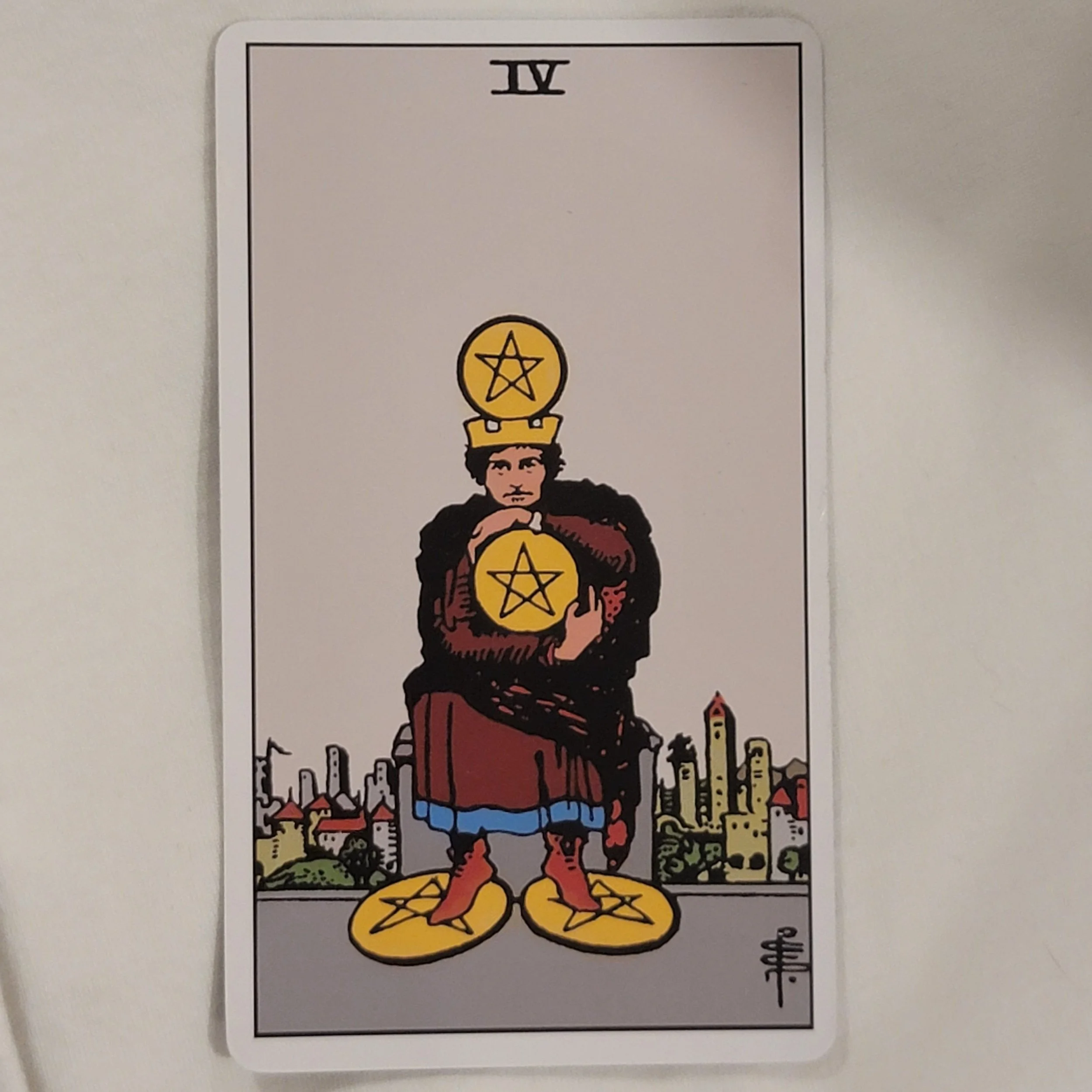 What does the Four of Pentacles card mean?