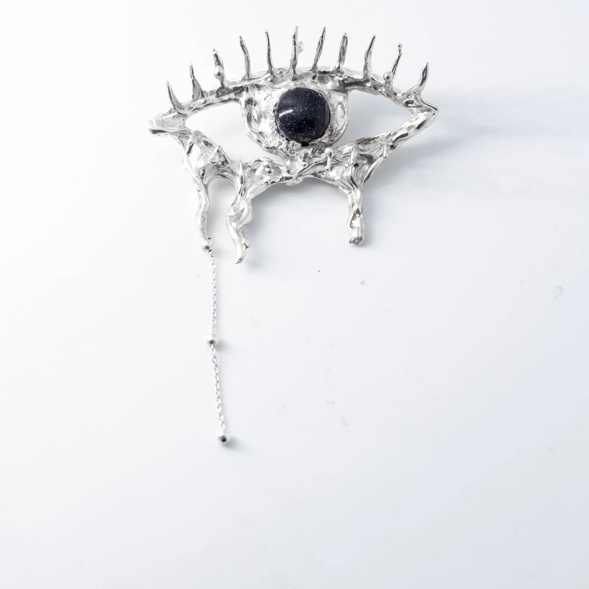 Black tearing eye necklace