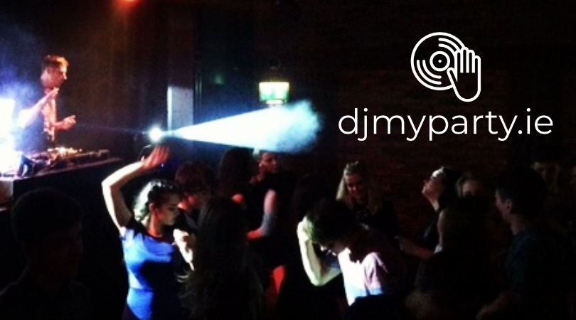 DJ performing at a nightclub with people dancing in dim lighting, logo for djmyparty.ie visible in corner.