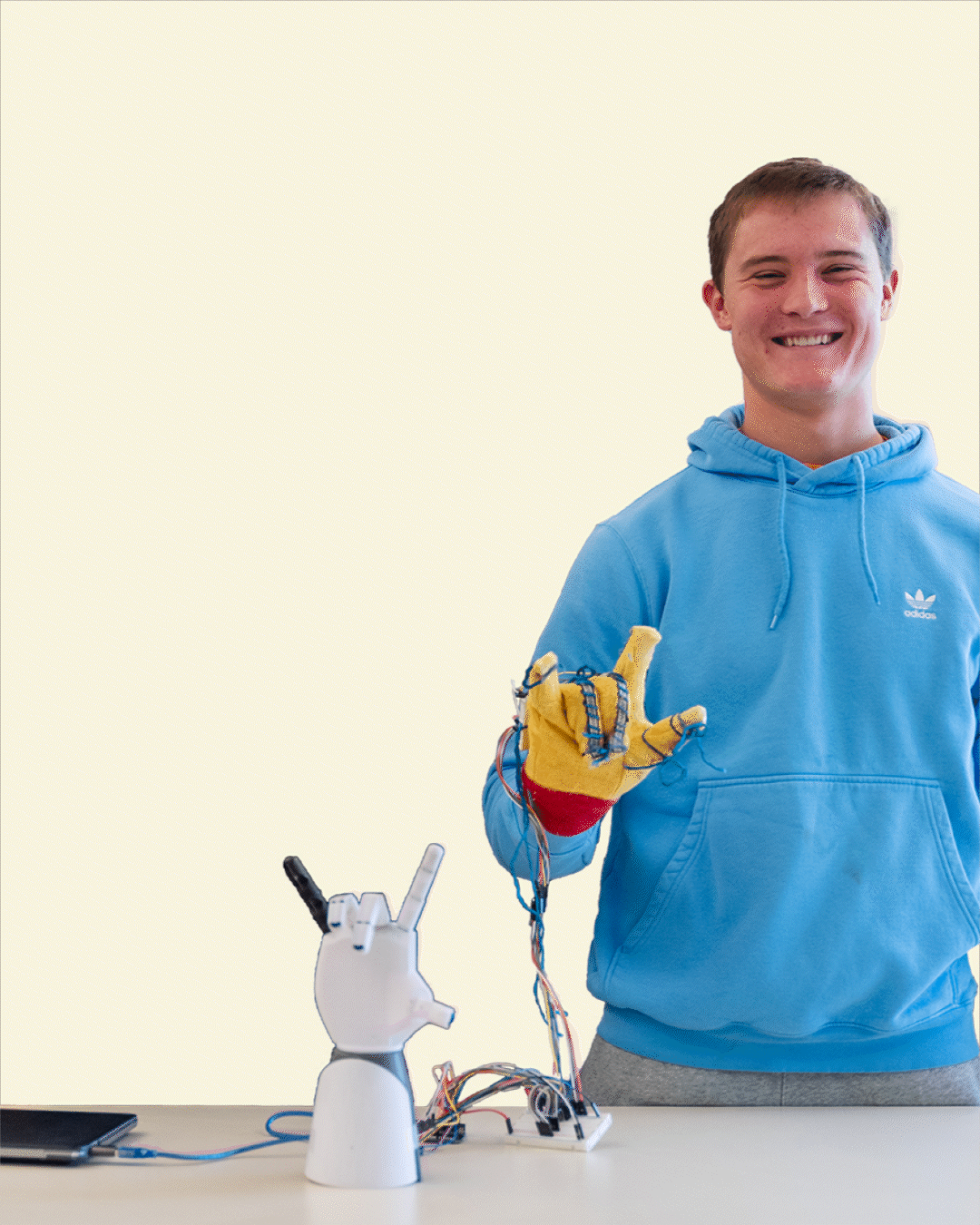 A gif of an Earlham student using a robotic hand with text that reads Get the classes you actually want to take. Confirm your spot now and register early.