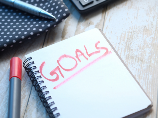 Notebook labelled ‘Goals’, symbolising setting goals without starting over or overwhelm.