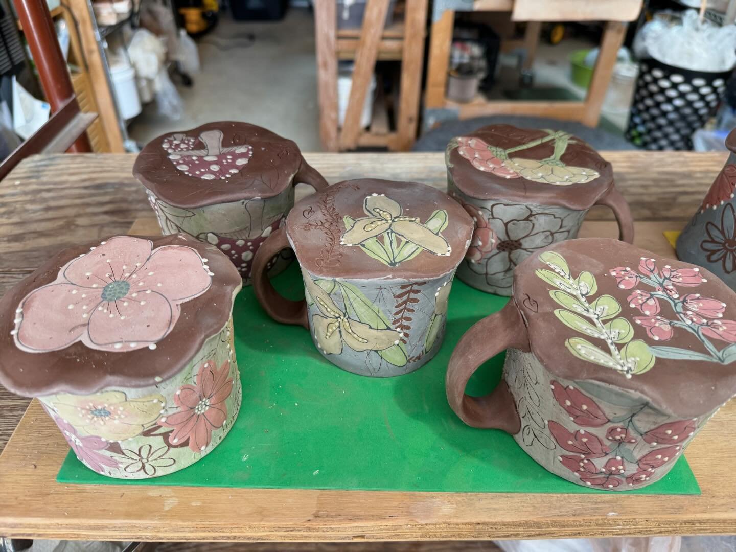 Bottoms up. Mugs and cups drying after layers of decorating. 
@throwntogetherpotters 

Thrown Together Spring Sale is
April 27th, 10-5
1225 Dade St, Charlotte
ONLINE May, 3rd at noon
Guest artist are: Betty McKim, Teresa Piesch and Lara O&rsquo;Keefe