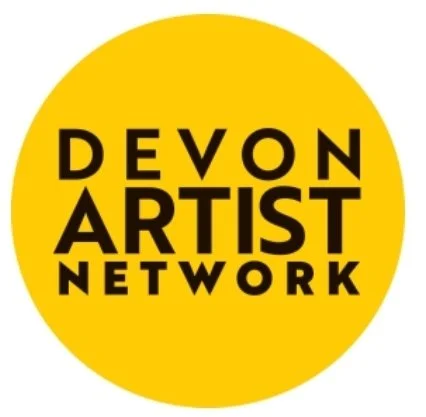 Yellow circle logo with black text reading 'Devon Artist Network'.