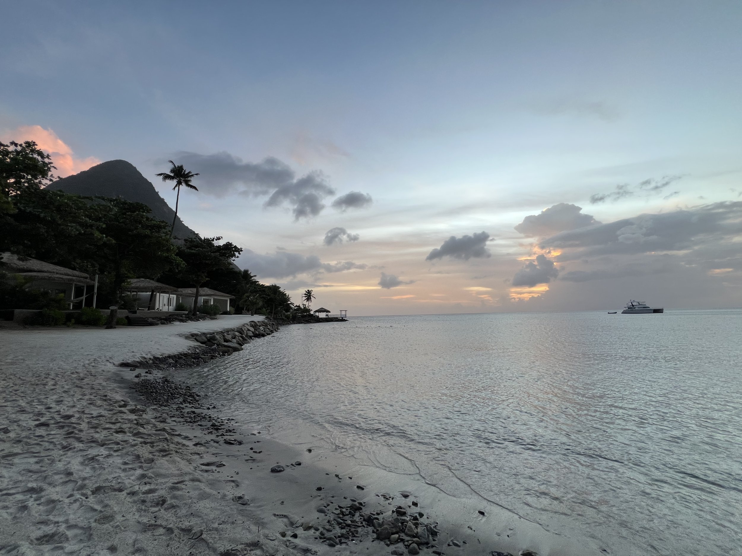 sunset at white sand beach of Sugar Beach, A Viceroy Resort