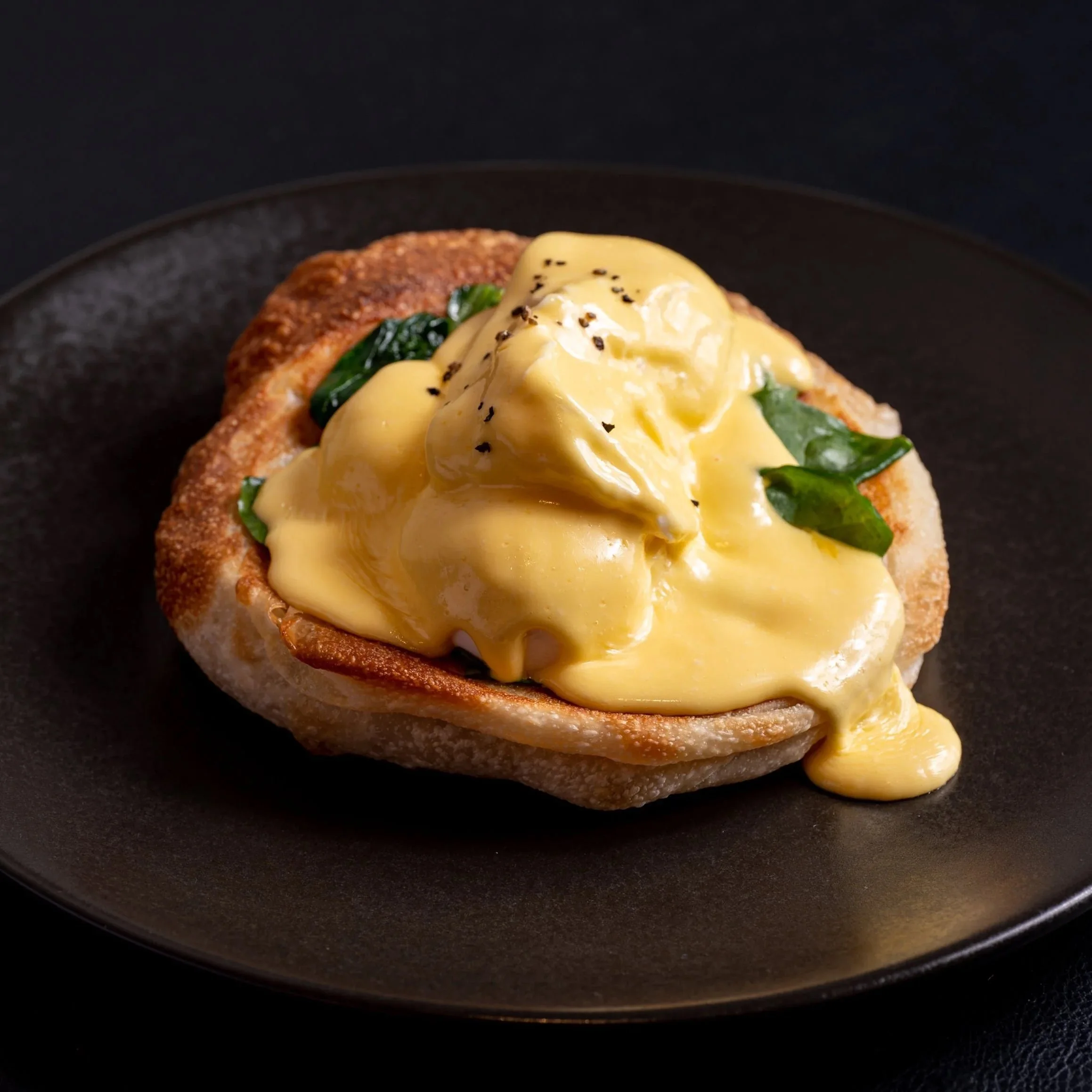Eggs Florentine roti coin with poached eggs, spinach and hollandaise at Kafe Kooks, Ultimo