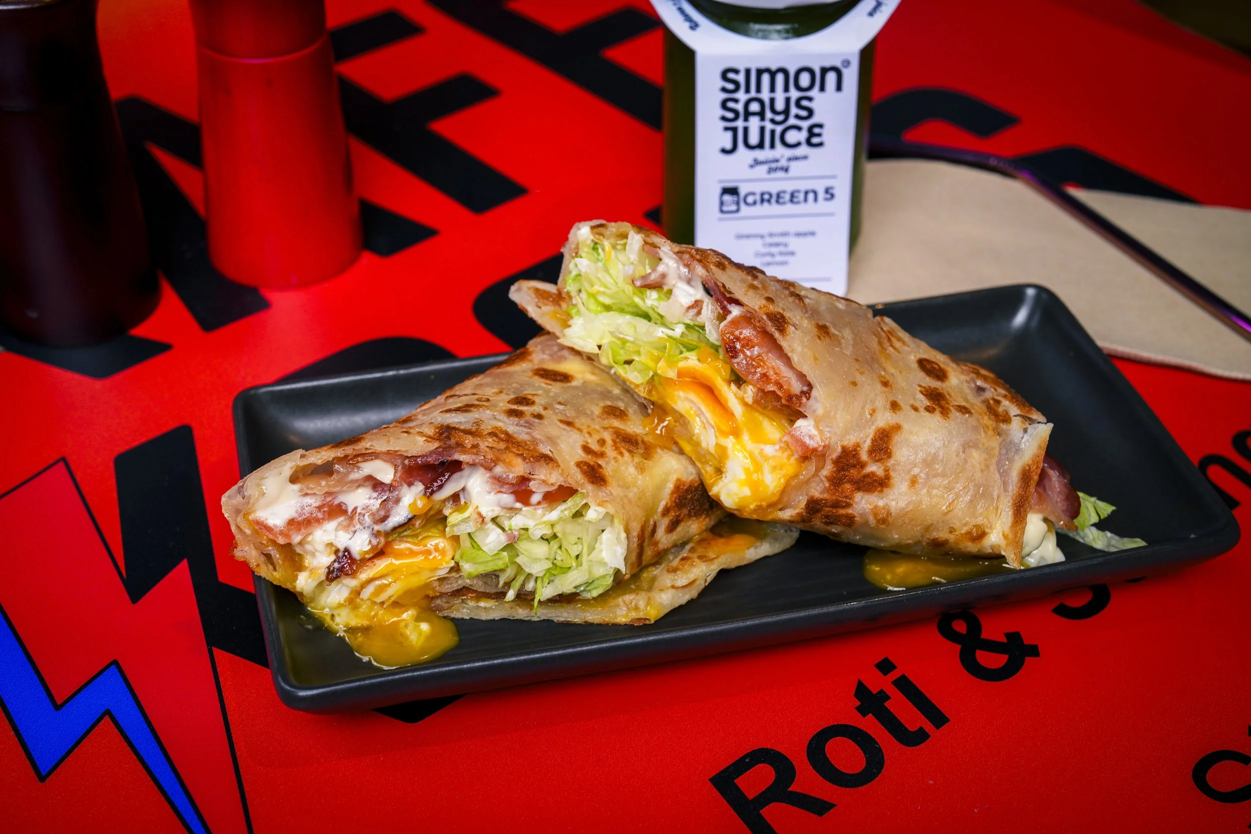 BELT breakfast roti wrap with bacon, egg and kewpie mayo, and a Simon Says green juice, at Kafe Kooks, Ultimo