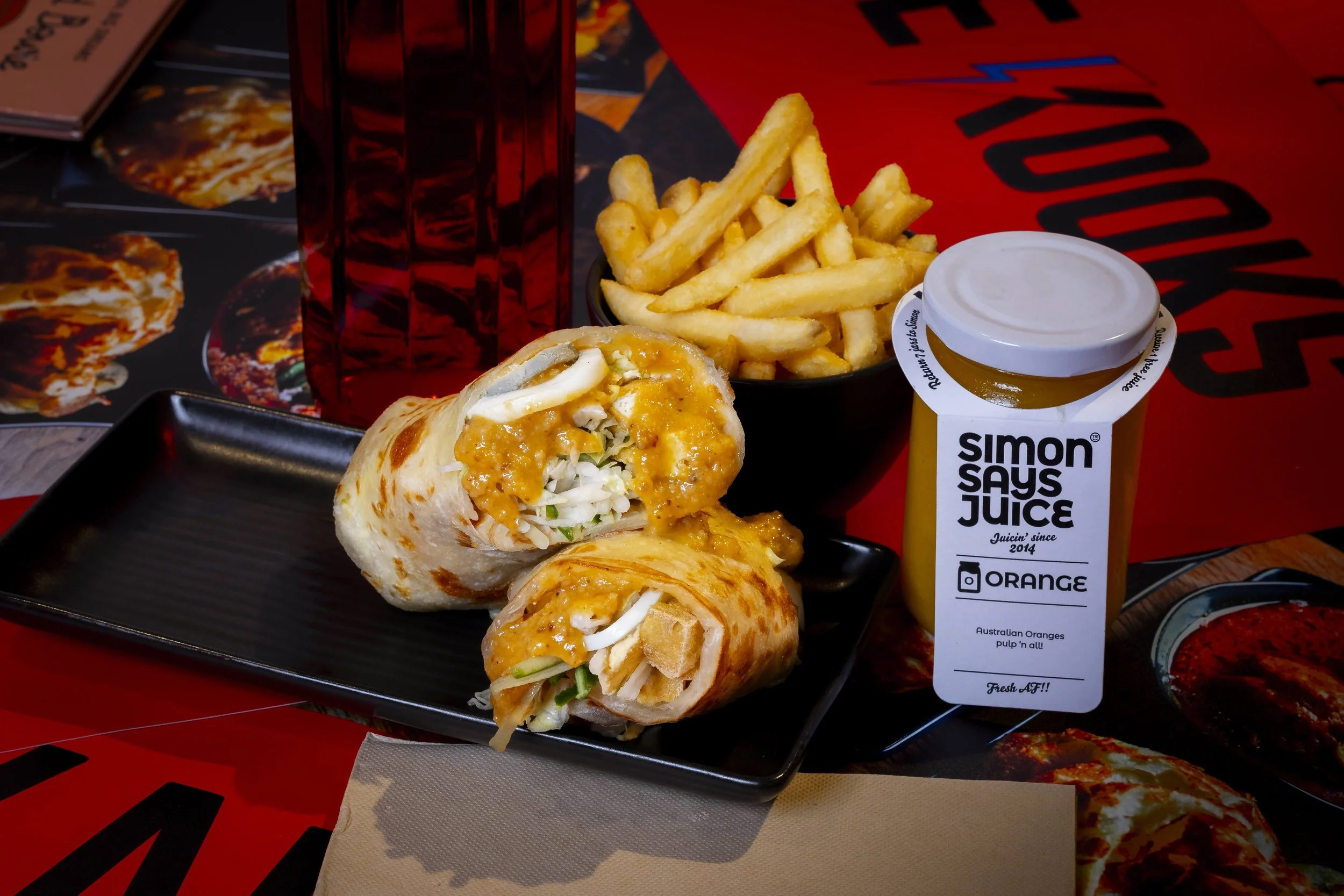 Gado gado roti wrap with fried tofu and satay sauce, chips and a Simon Says orange juice, at Kafe Kooks, Ultimo