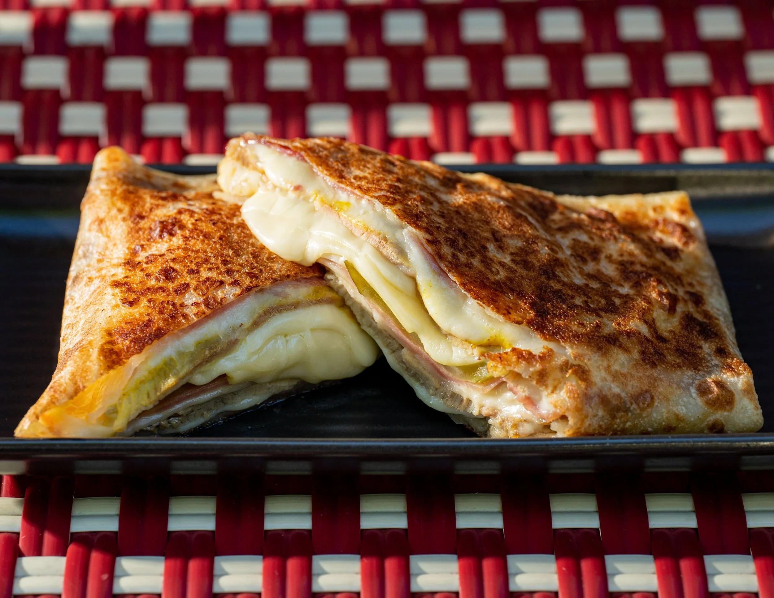 Our take on a classic sandwich that started in Miami USA. Roasted pork, smoked ham, swiss cheese, pickled cucumber and mustard are all pressed together to give you a taste sensation like no other