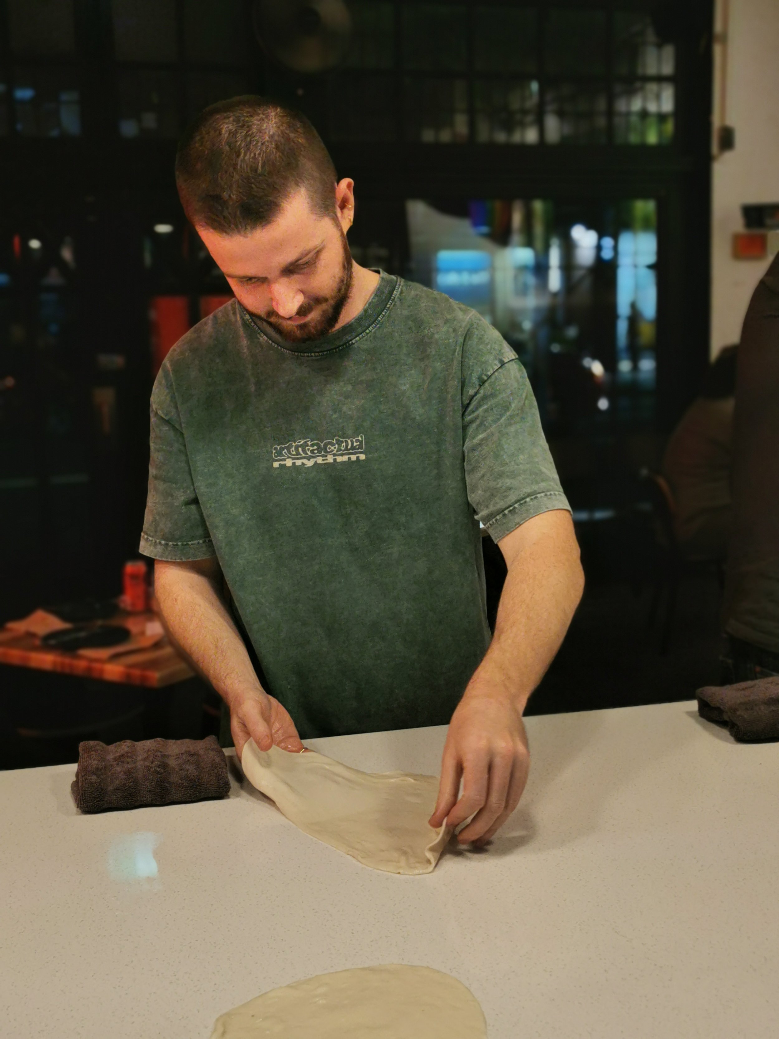 First-timer stretching roti dough at Sydney's only roti restaurant