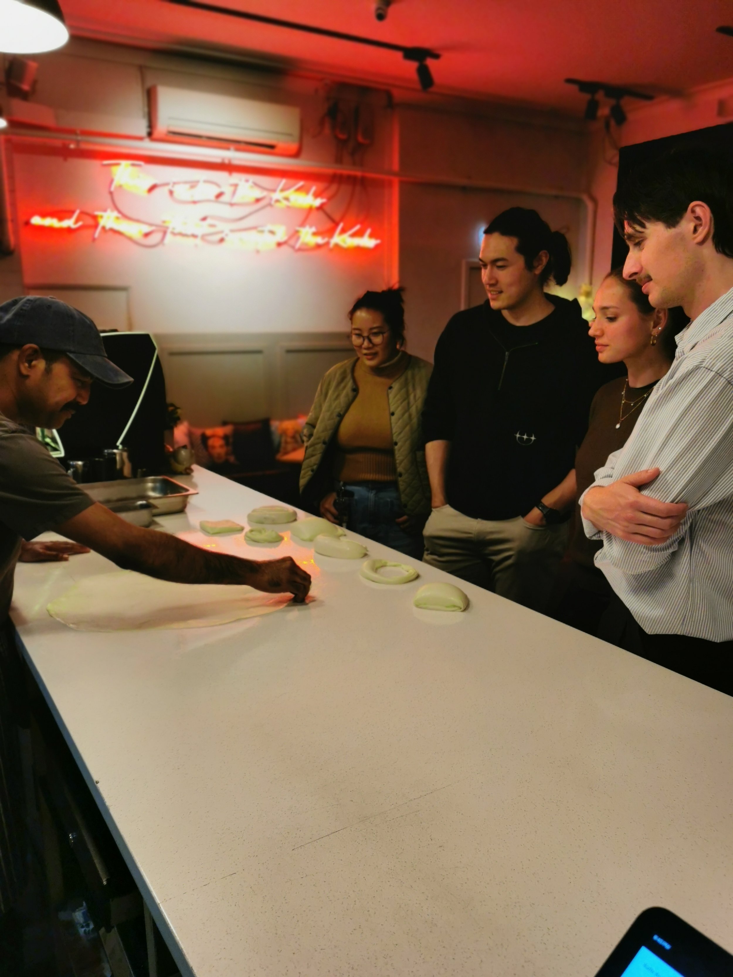 Learning to flip roti with Roti Master Suresh at Kafe Kooks