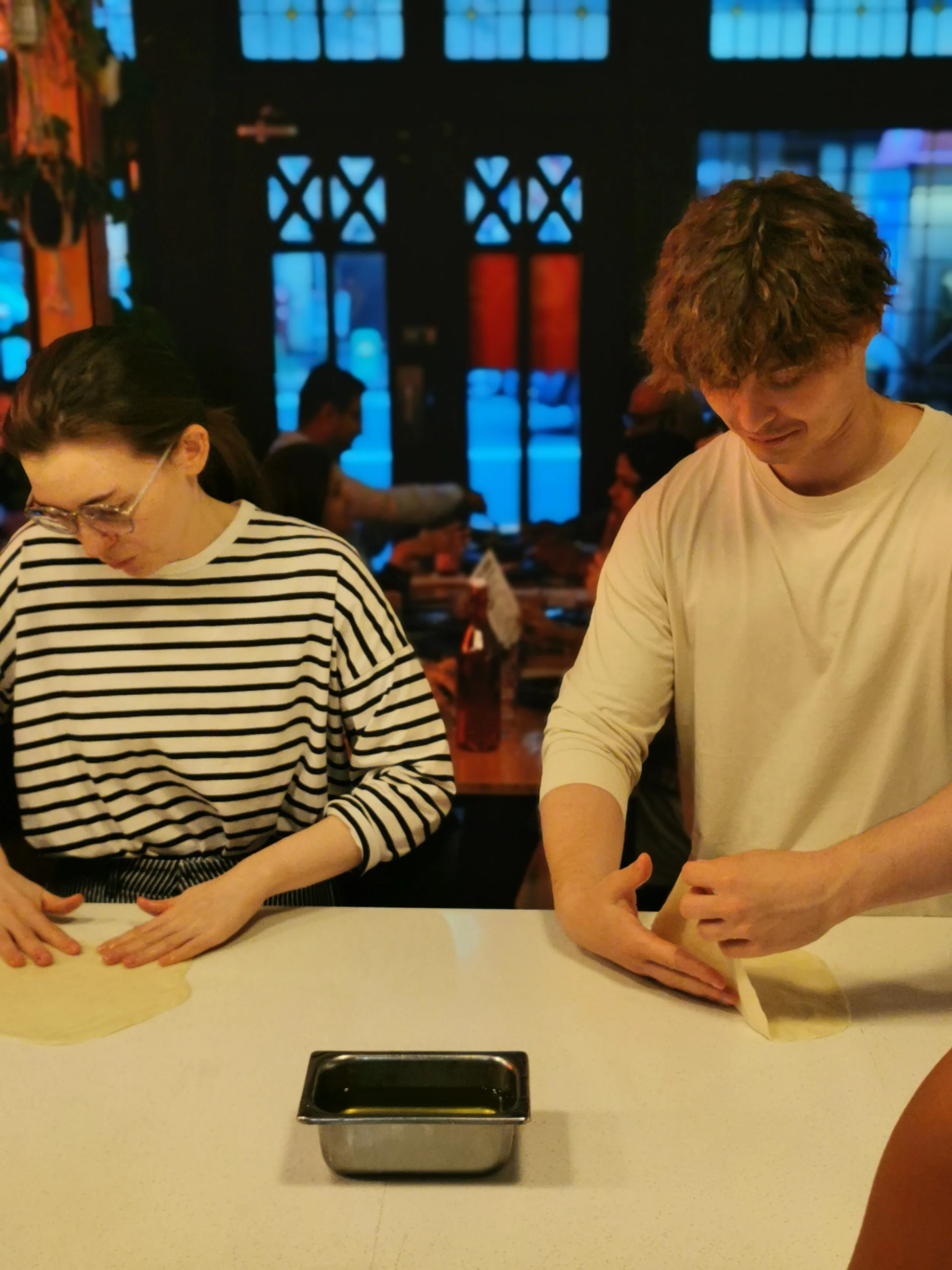 Learning the traditional roti stretch at Kafe Kooks Masterclass