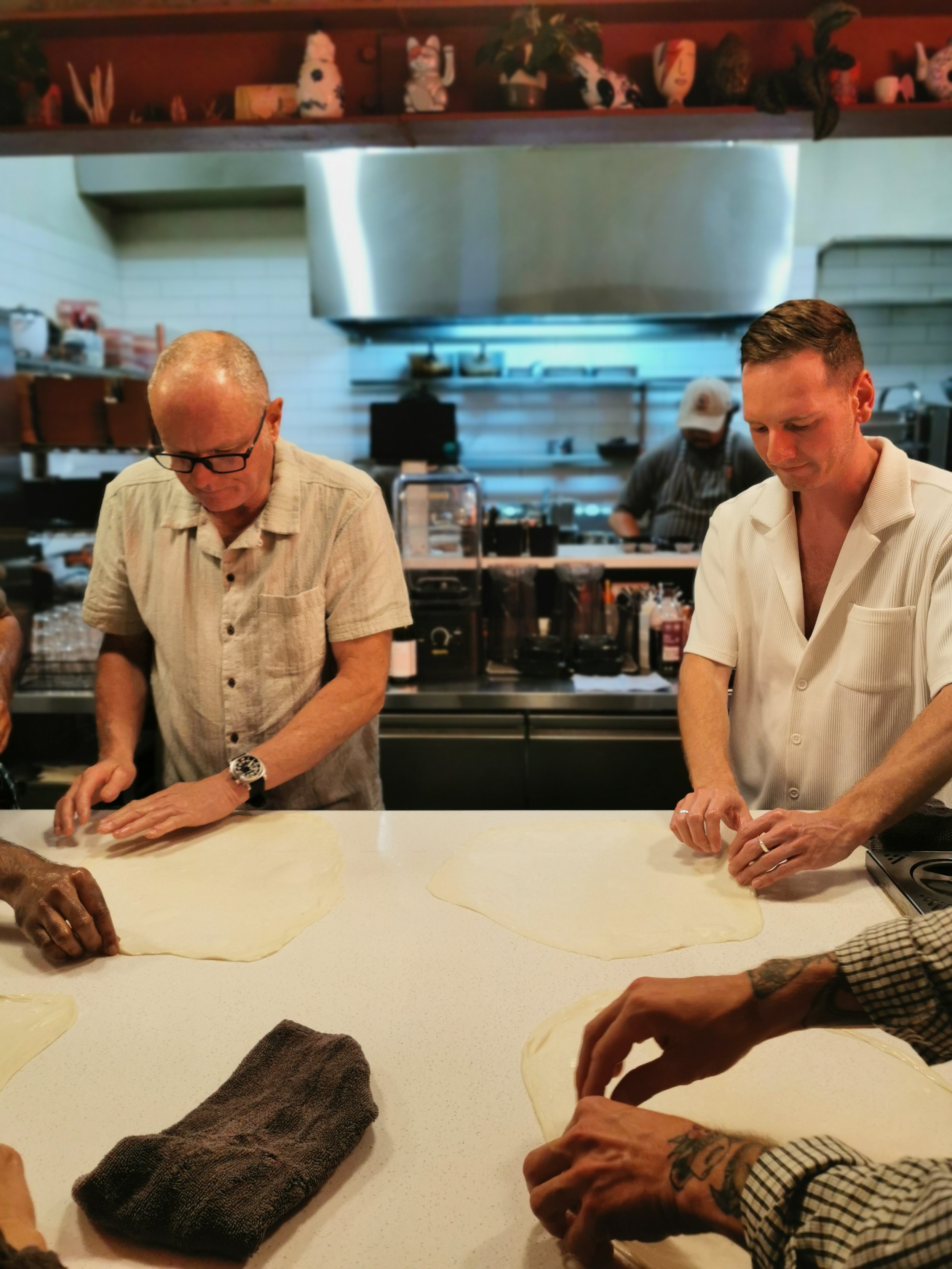 First-timer learning to stretch roti dough the old fashion way at Sydney's only roti restaurant