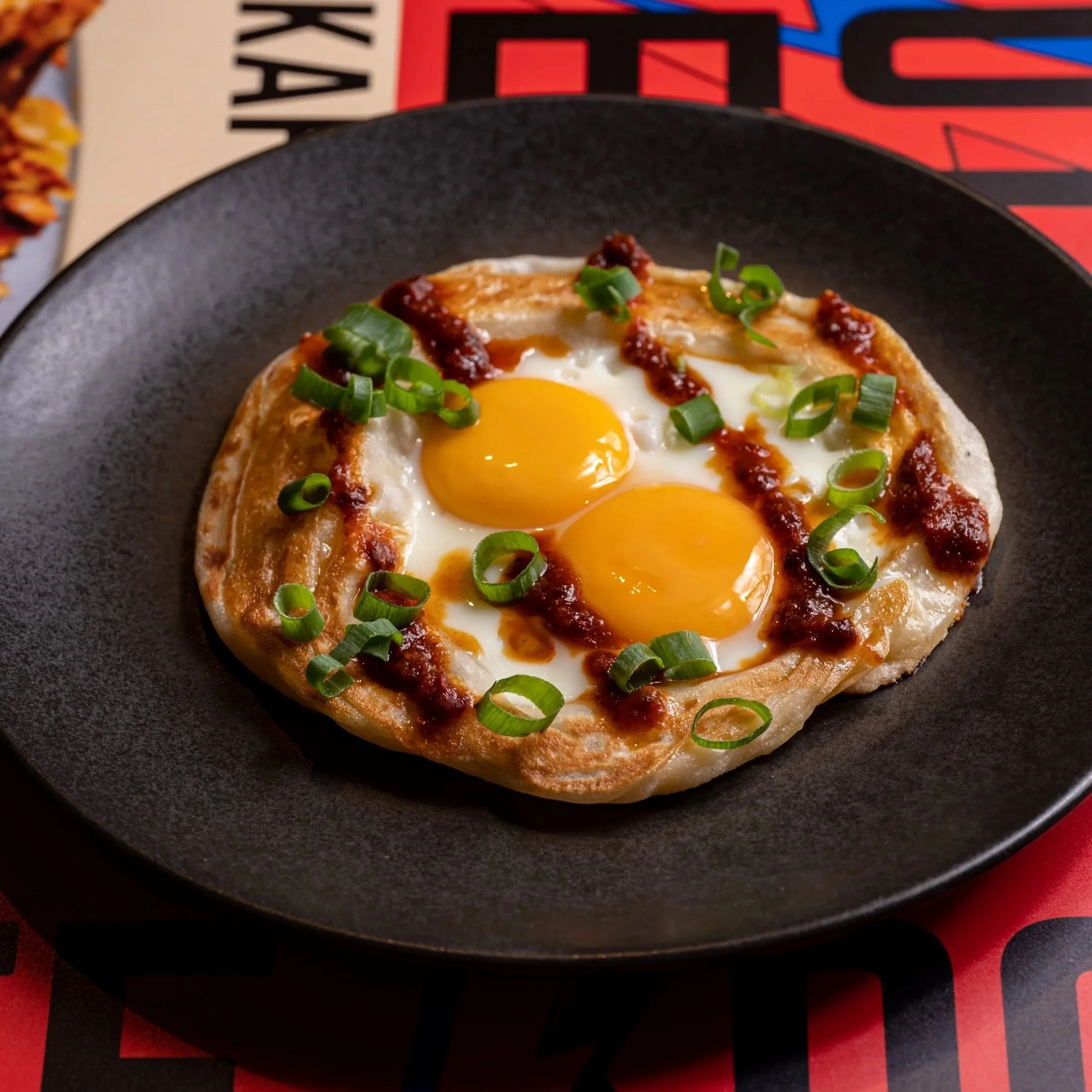 Sarang Burung, two fried eggs in a roti paratha ring with house-made sambal, at Kafe Kooks, Ultimo