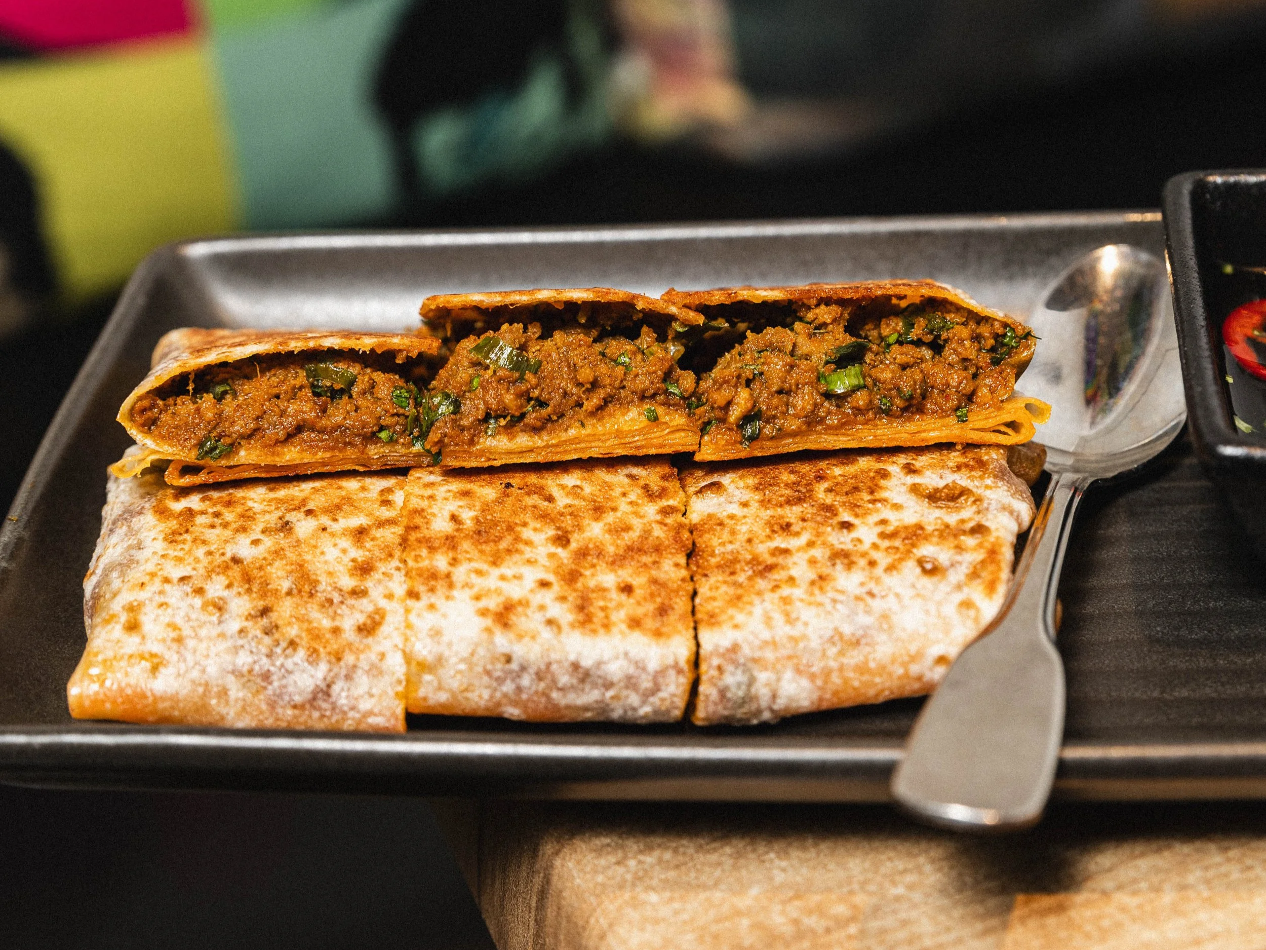 Thai beef madtarbak (murtabak), roti filled with Thai beef curry, with cucumber relish, at Kafe Kooks, Ultimo
