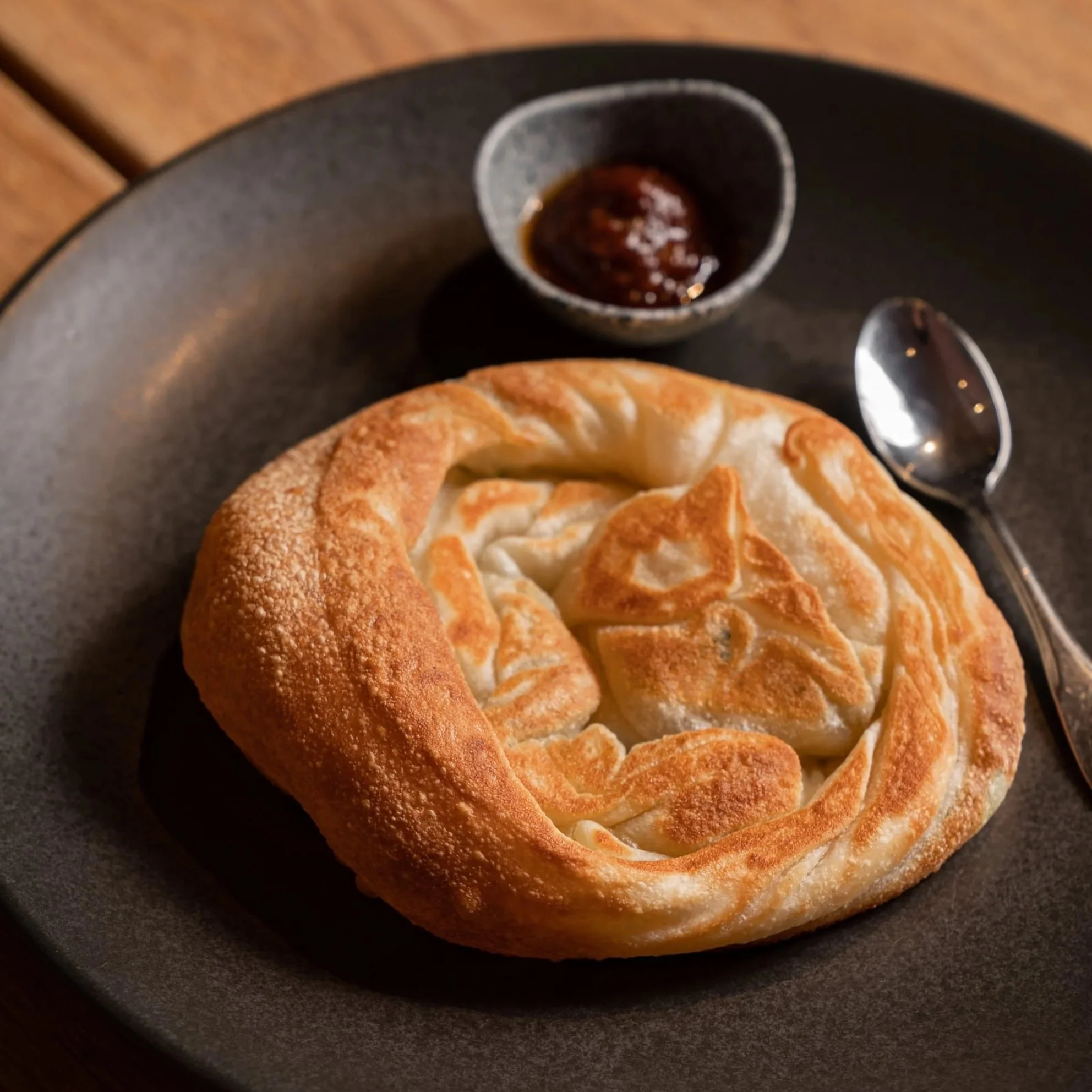 Scallion pancake, roti filled with spring onion, served with sambal, at Kafe Kooks, Ultimo