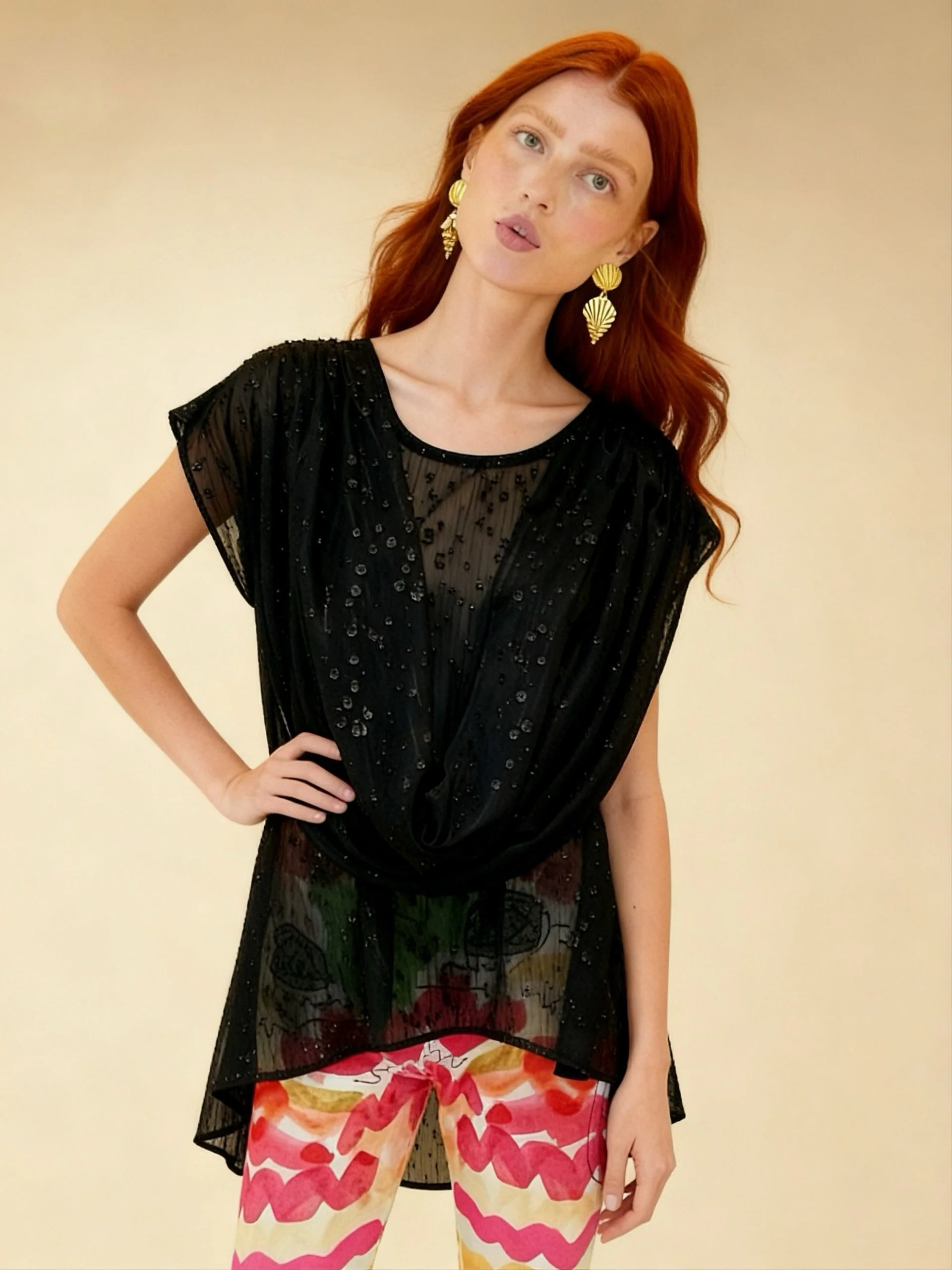 That draped detail is everything 😍🖤 This black chiffon top is sheer elegance &mdash; delicate embellished texture, draped front, cap sleeves and a hi-low hem that moves beautifully ✨

Effortlessly glamorous layered over anything 🌿

Shop now 👉 ros
