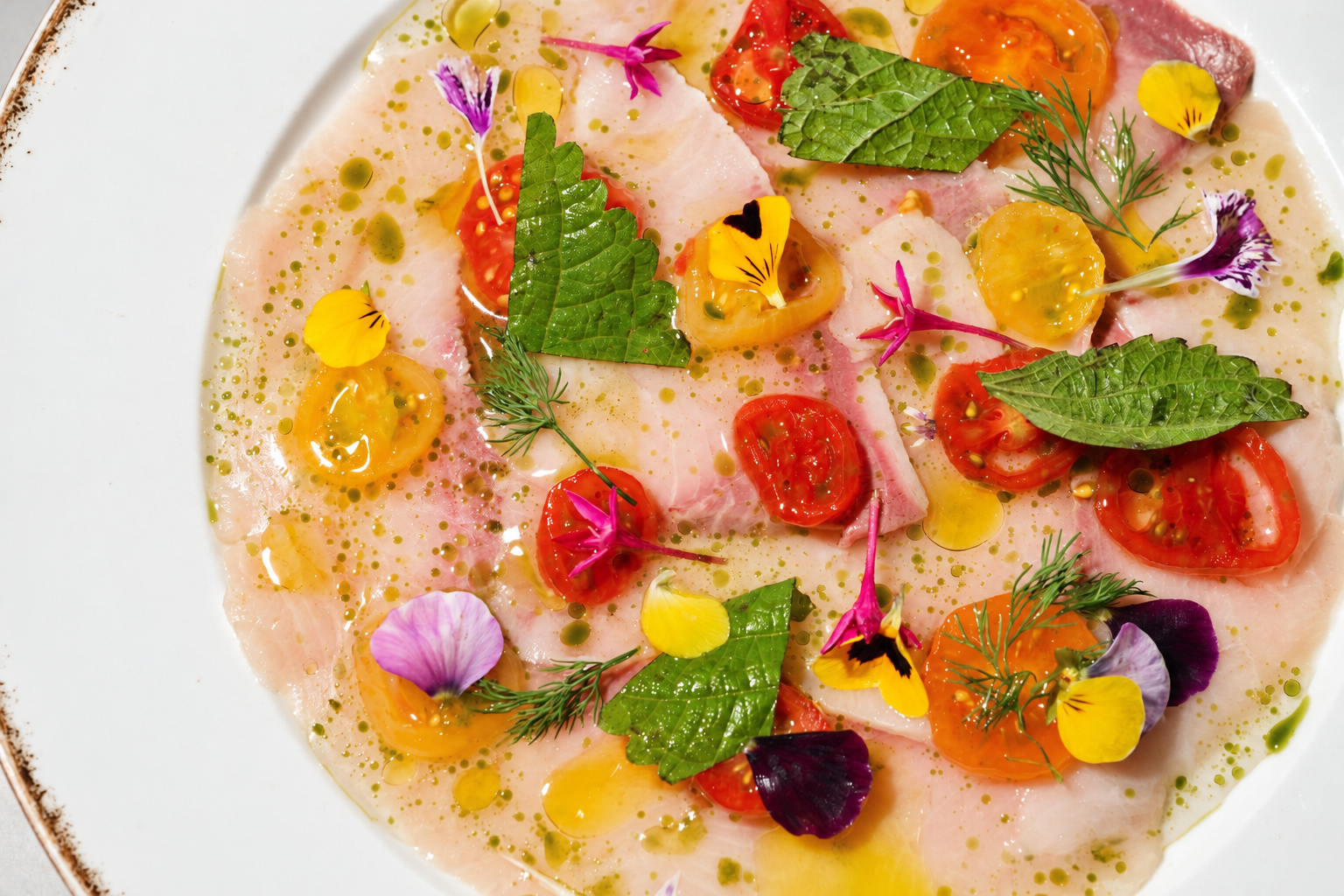 Vibrant Fish Carpaccio with Edible Flowers.png