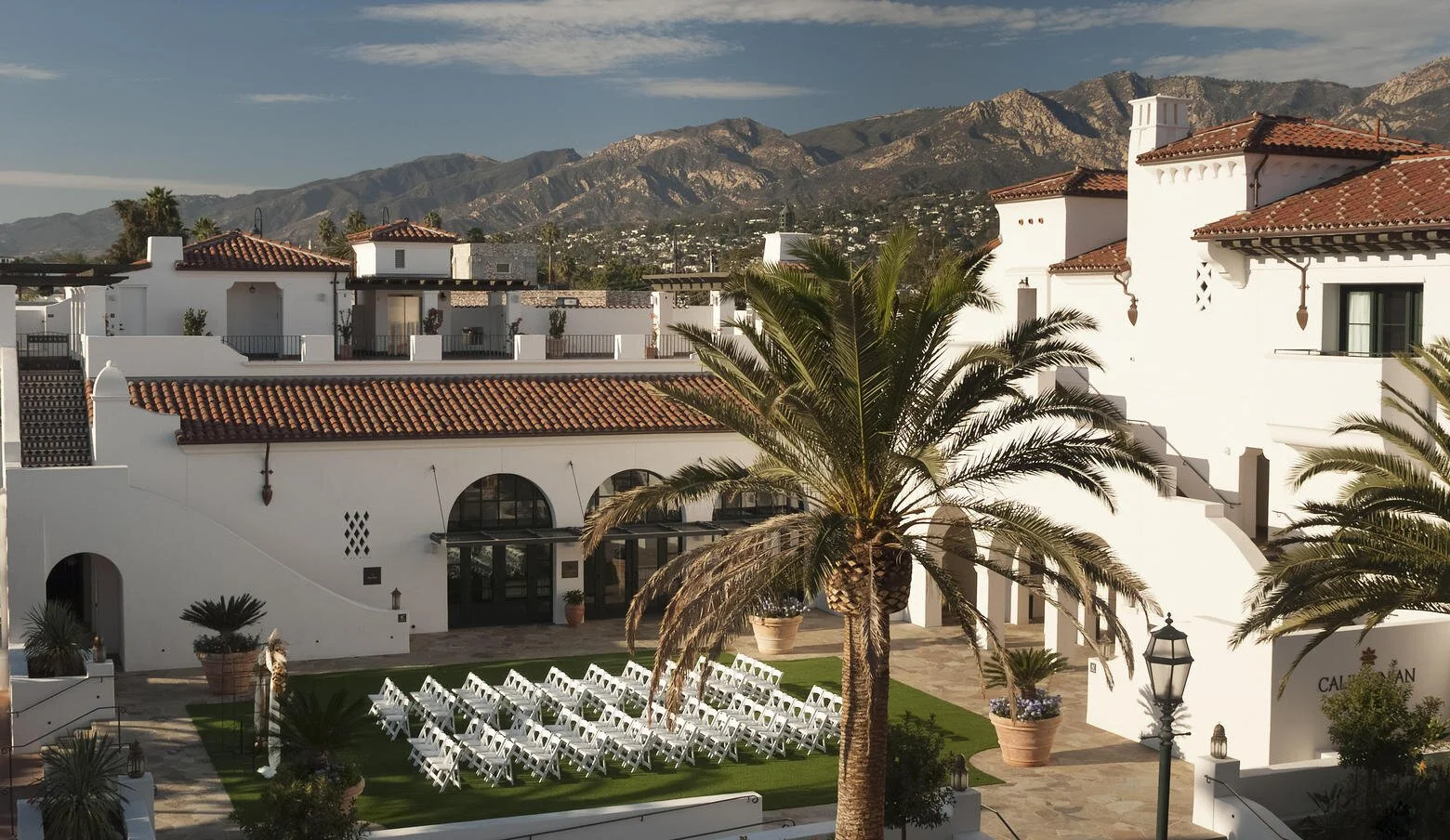 Wedding ceremony chairs in the courtyard at Hotel Californian, with Santa Barbara mountain views